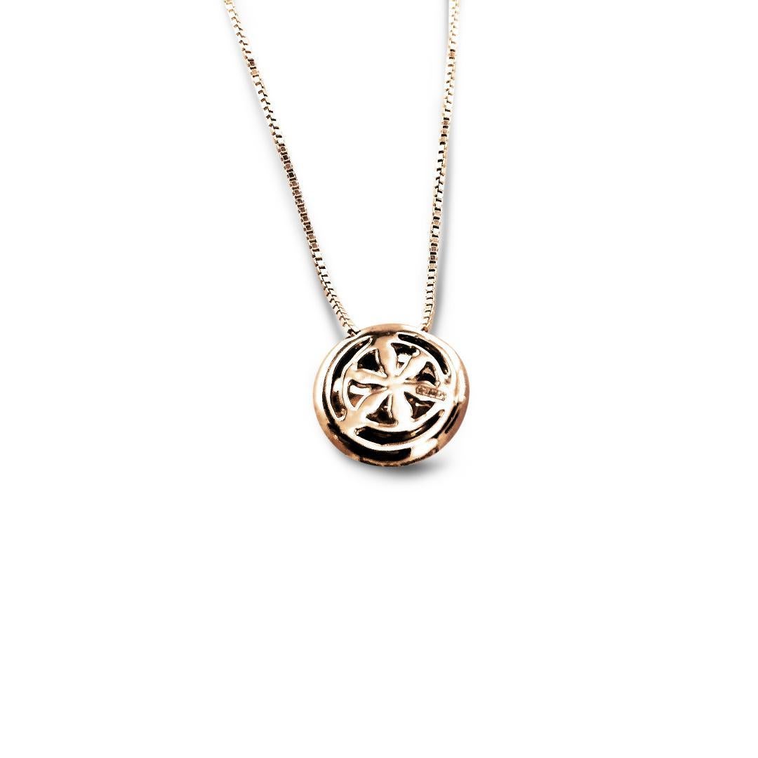 This 18Kt Rose Gold sprinkled with diamonds Caterina chain necklace, was designed and inspired by Leonardo da Vinci's architectural drawings.

The chain dangles a circular matted Rose Gold pendant which is designed with one white Gold star in the