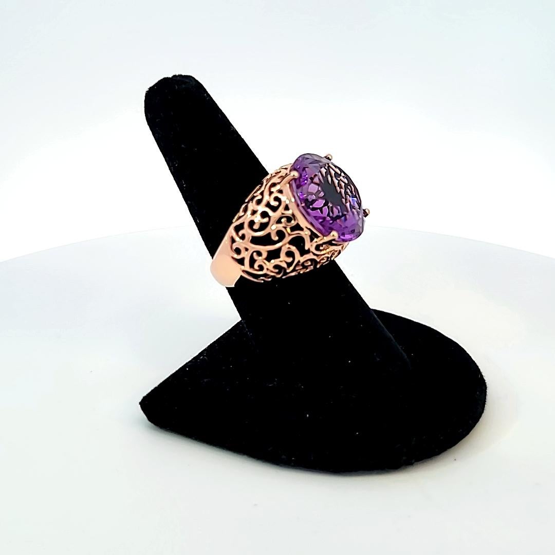 With a beautiful, pierced, 14 karat rose gold mounting, this round amethyst just pops!