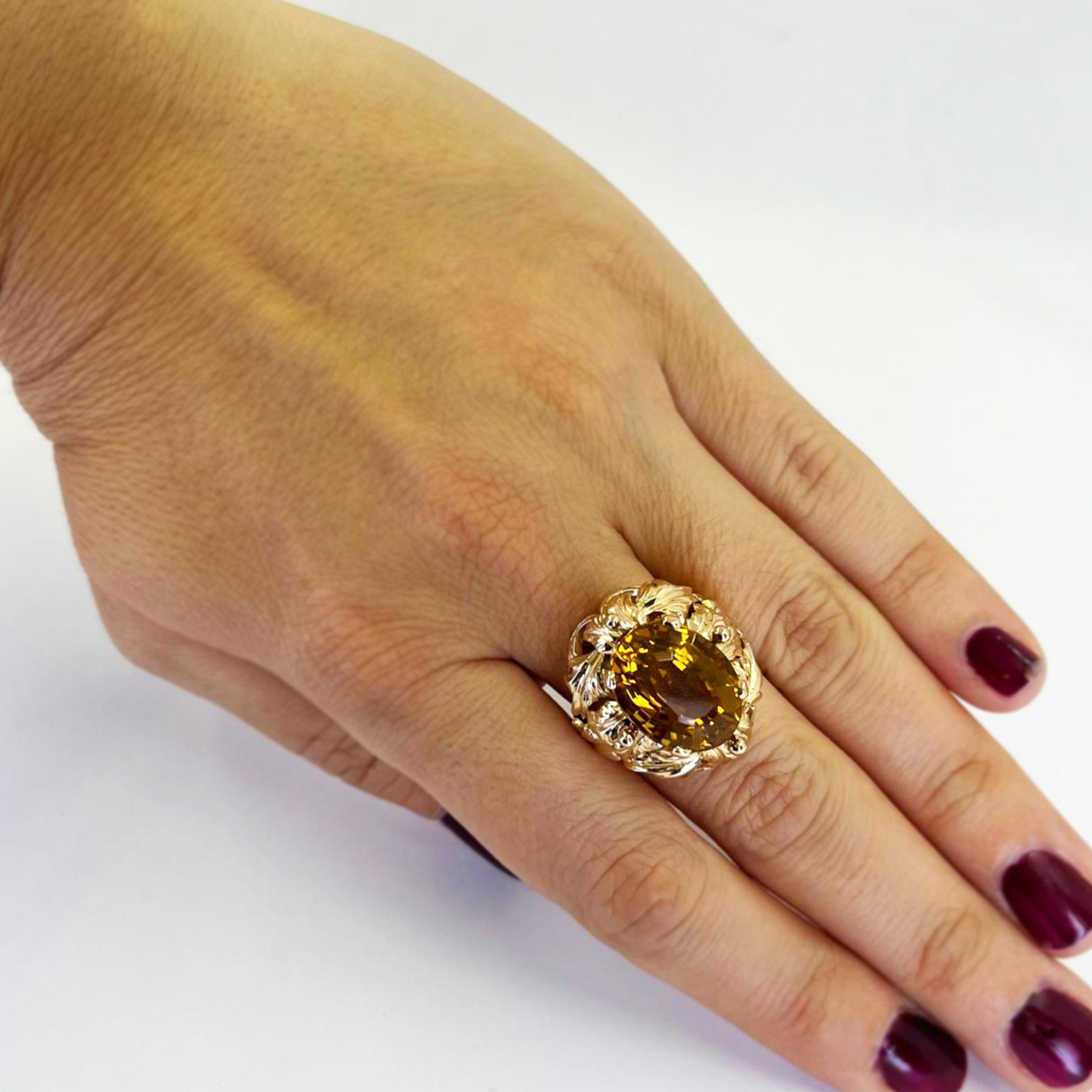 Large 18 karat rose gold cocktail ring featuring an oval citrine estimated to weigh 9.4 carats accented by a leaf design. Finger size 6.5. Includes one sizing service prior to shipping, upon request. Finished weight is 16.0 grams.