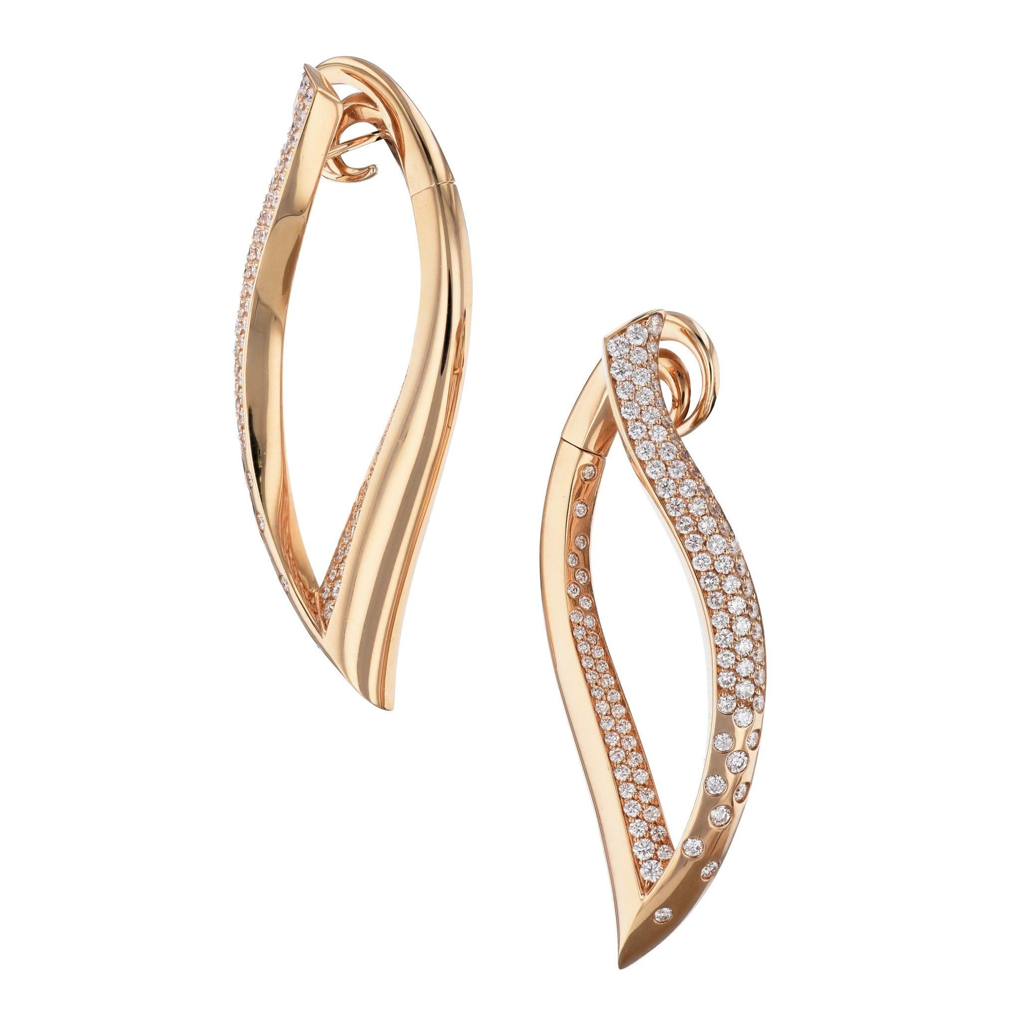 These stunning long drop earring are sure to make a statement!

These are crafted from 18 karat rose gold, and have a total weight of 3.38 carats.
Rose Gold and Diamond Pave Earrings.

They measure 2.5 inches in length and 1 inch in width.
