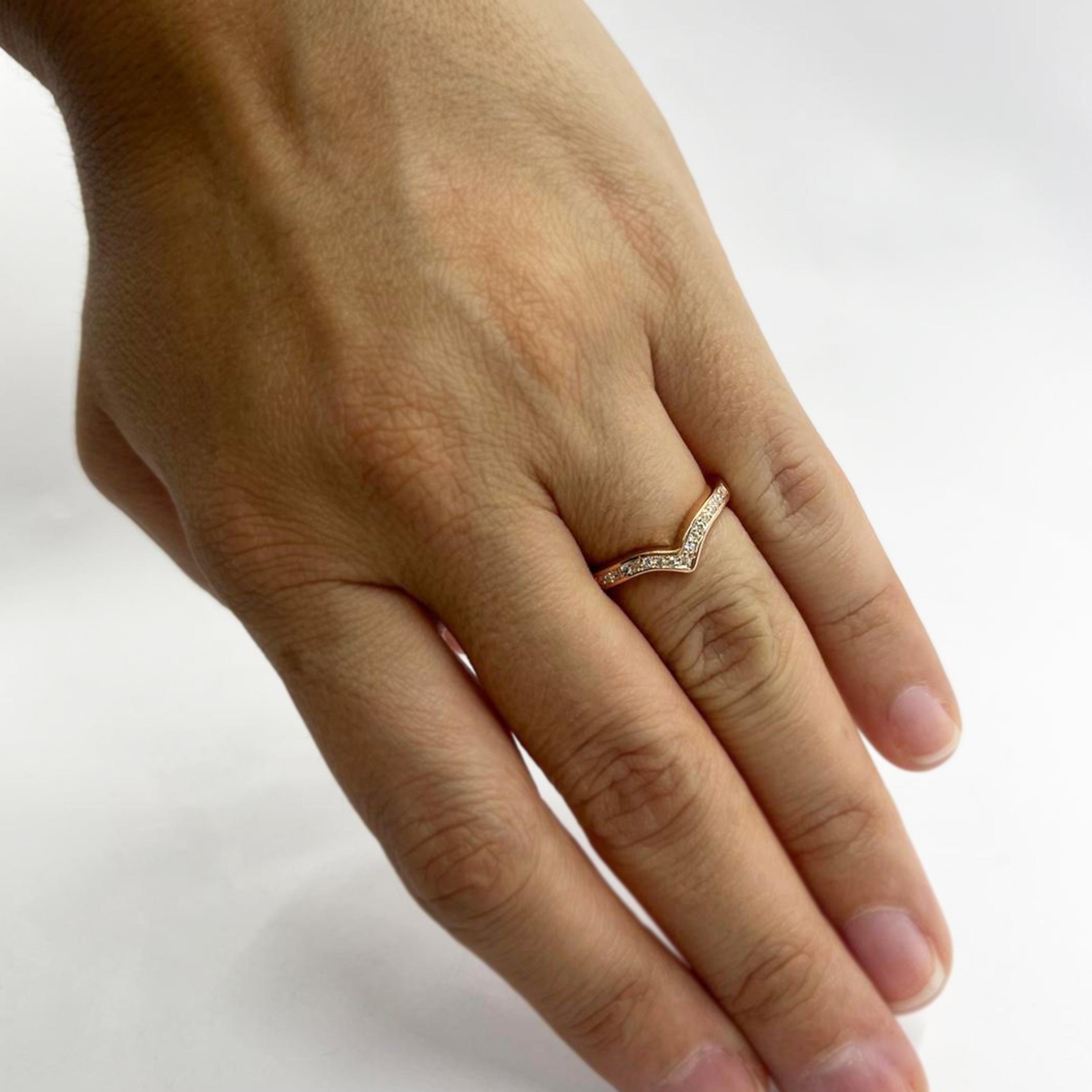 14 Karat Rose Gold V Band Featuring 17 Prong Set Round Brilliant Cut Diamonds of VS Clarity and G/H Color Totaling 0.08 Carats. Finger Size 6. Includes One Sizing Service Upon Request, Prior to Shipping. Finished Weight is 2.5 Grams.