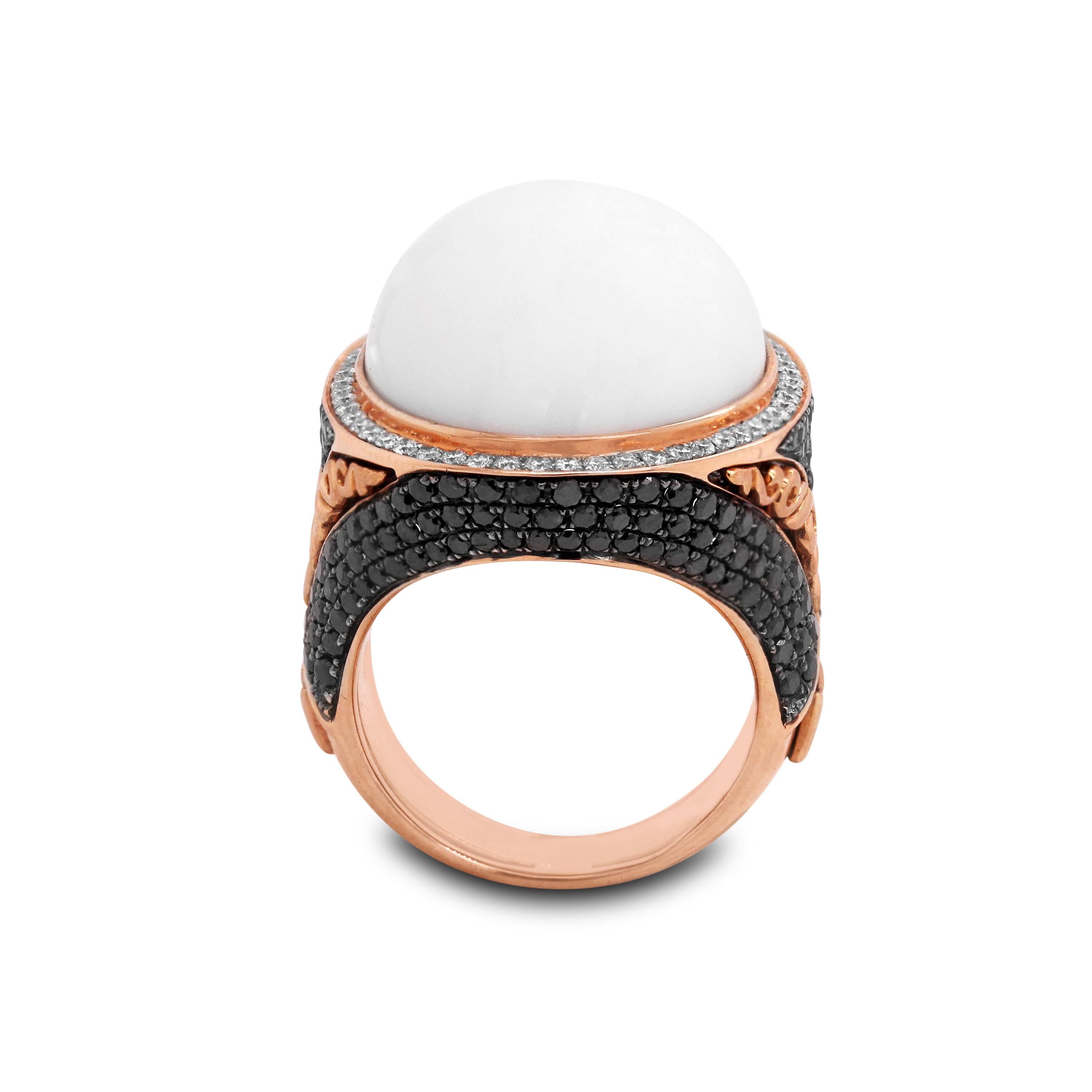 14K Rose Gold White and Black Diamond Ring with White Agate Center

2.22 carat diamonds total weight. Black diamonds are set throughout the ring with white diamonds set surrounding the center White Agate.

Ring face is 1.05 inch by 0.90 inch. 0.40