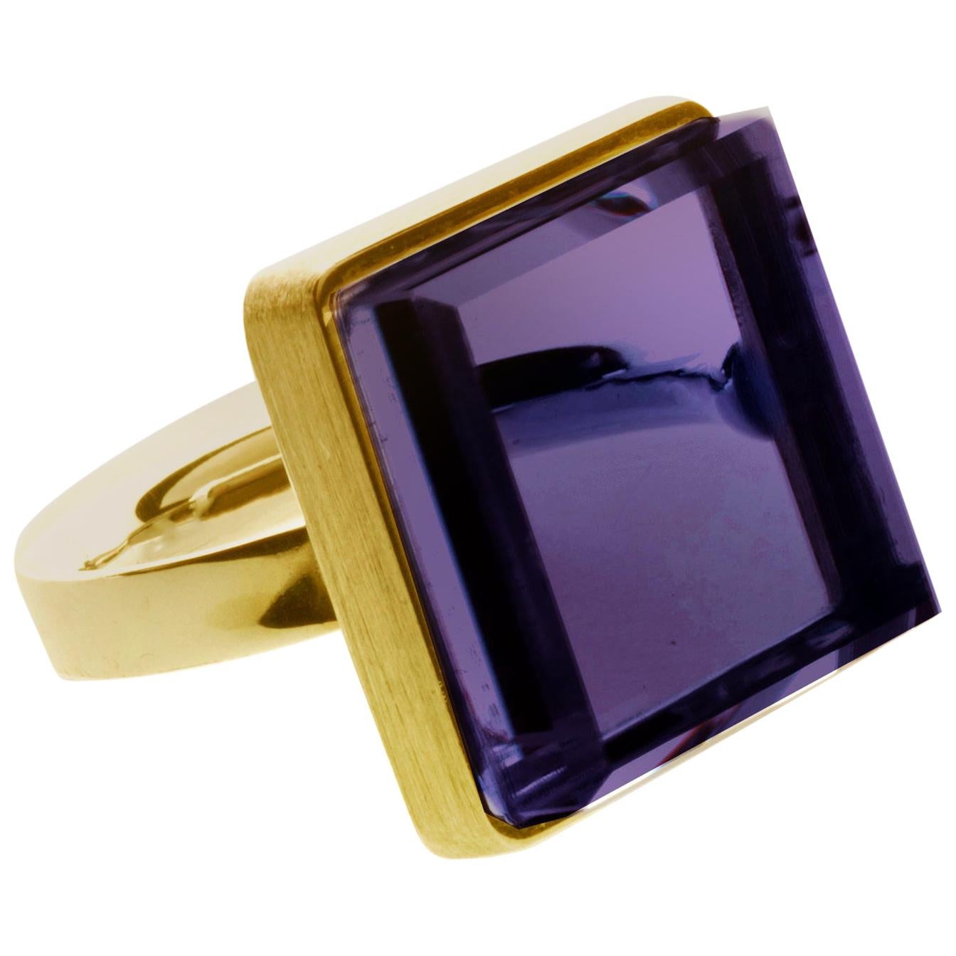 This contemporary men ring is in 14 karat rose gold with 15x15x8 mm dark grown amethyst. It was published in Harper's Bazaar and Vogue UA. The piece can be ordered in the other colours, such as green amethyst, natural purple amethyst (it will be