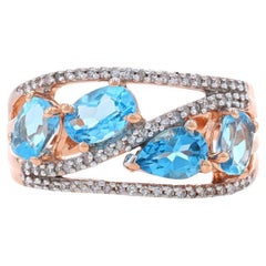 Rose Gold Blue Topaz & Diamond Four-Stone Band - 10k Oval & Pear 2.00ctw Ring