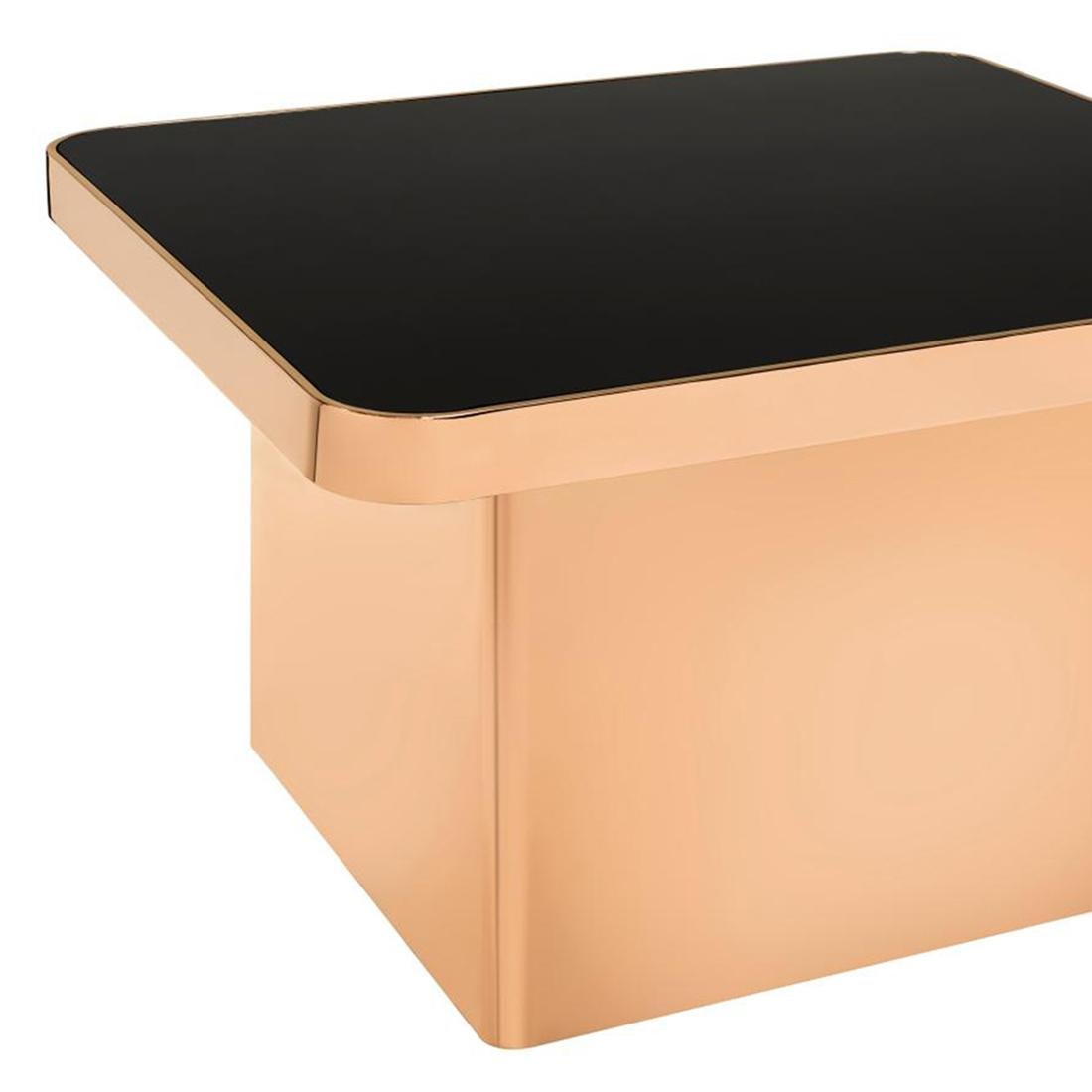 Center table rose gold with steel structure in light
rose gold chromed finish and with blackened glass top.