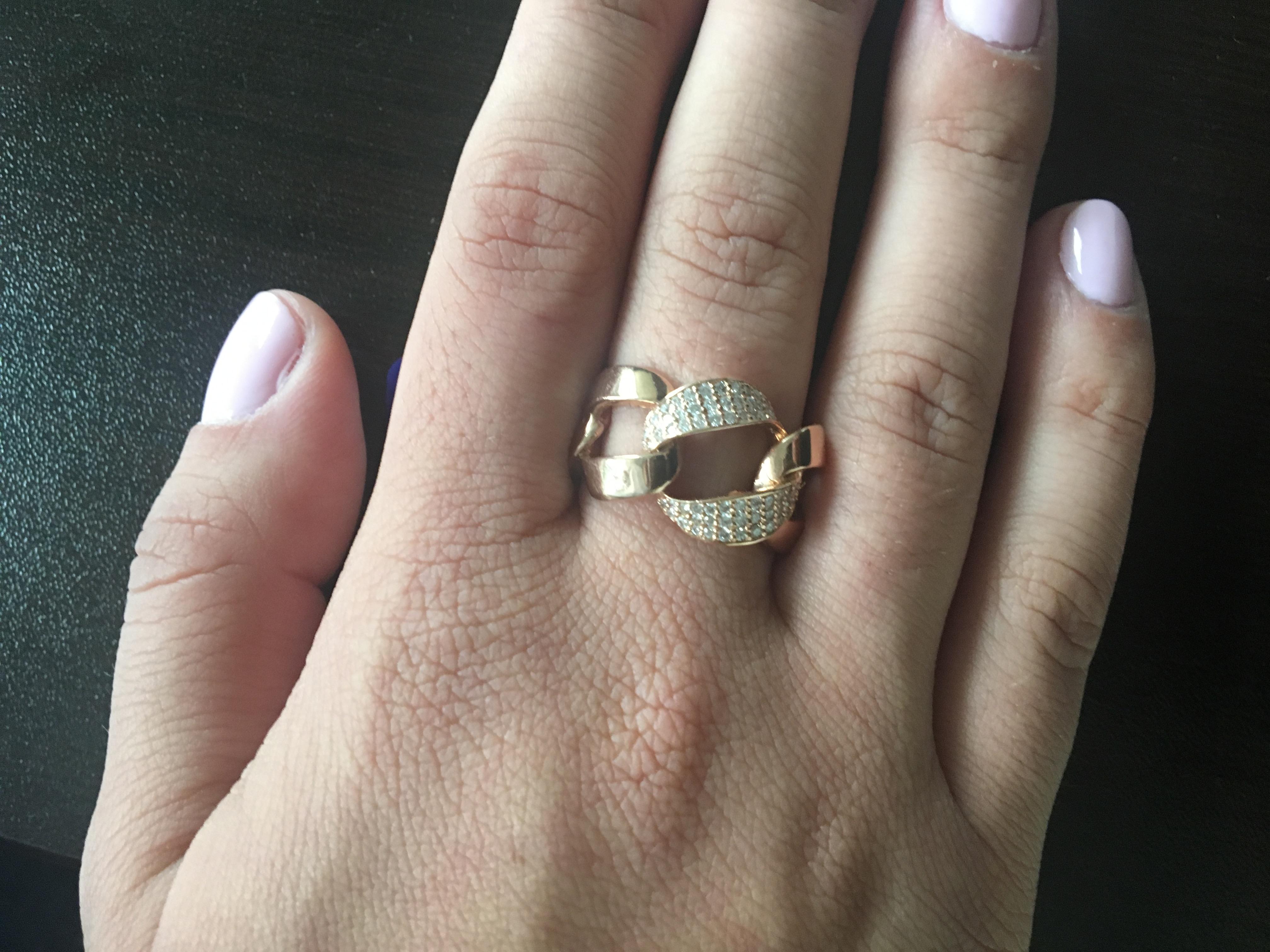 Chain link ring set in 14K rose gold. The total carat weight is 0.40 in diamonds. The color and clarity is G and the clarity is SI. This chain ring is the latest fashion in the jewelry industry. It's a timeless piece that every woman can wear. The