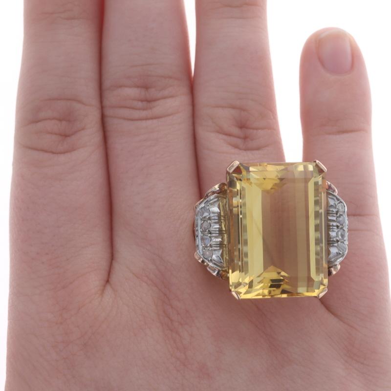 Size: 9 1/2
Sizing Fee: Up 2 sizes for $40 or Down 1 size for $30

Era: Retro
Date: 1940s - 1950s

Metal Content: 14k Rose Gold & 14k White Gold

Stone Information
Natural Citrine
Treatment: Heating
Carat(s): 45.57ct
Cut: Emerald
Color: Yellow
Size: