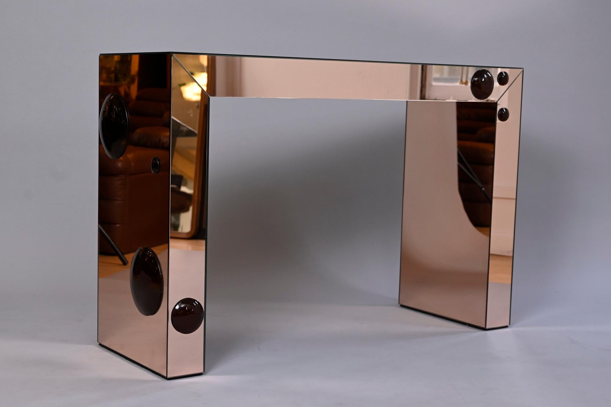 Unique consoles in mirrored rose gold with raised bronze glass 'spots'

Available in different colour combinations. And sizes...

Please enquire 

Also, available with matching concave mirrors.. Bespoke sizes.