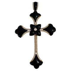 Pendentif croix en or rose avec diamants et onyx noir