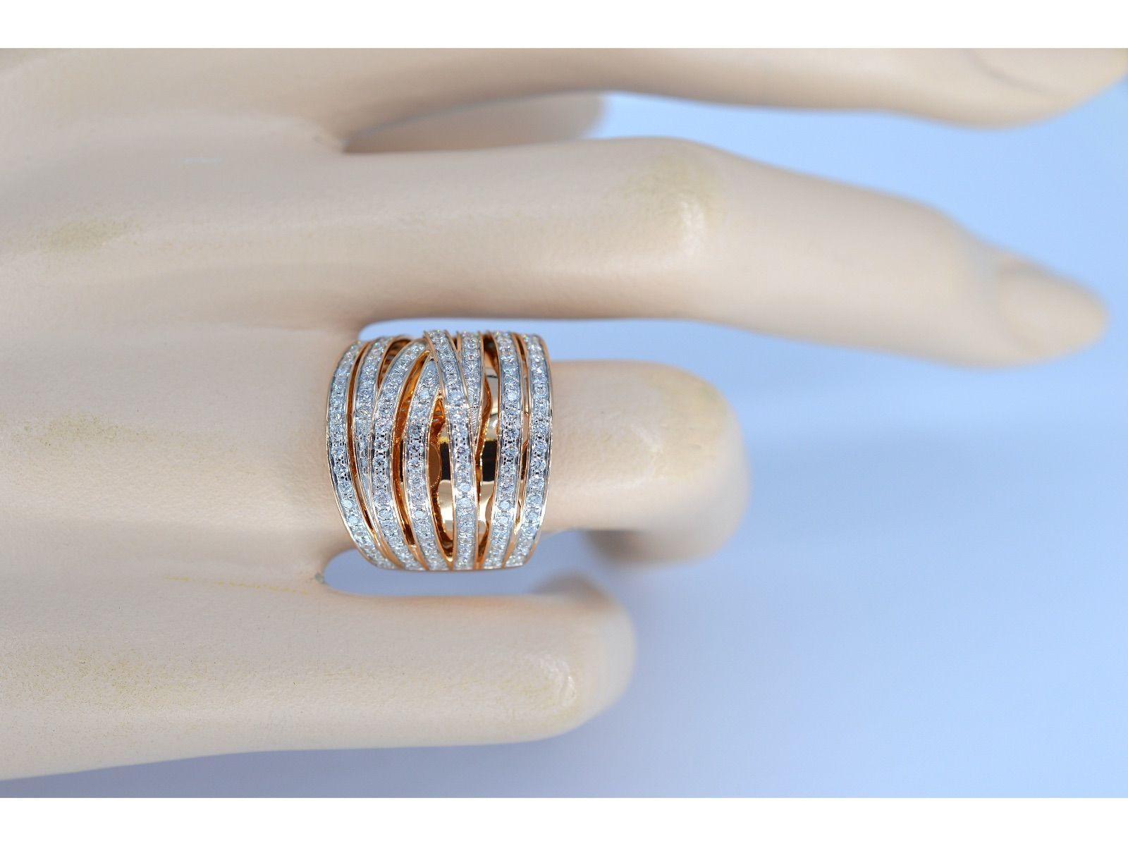 An 18K rose gold design ring with high quality brilliant cut diamonds is a striking and sophisticated piece of jewelry that combines the warmth of rose gold with the brilliance of diamonds. The band is typically made of 18K rose gold, which
