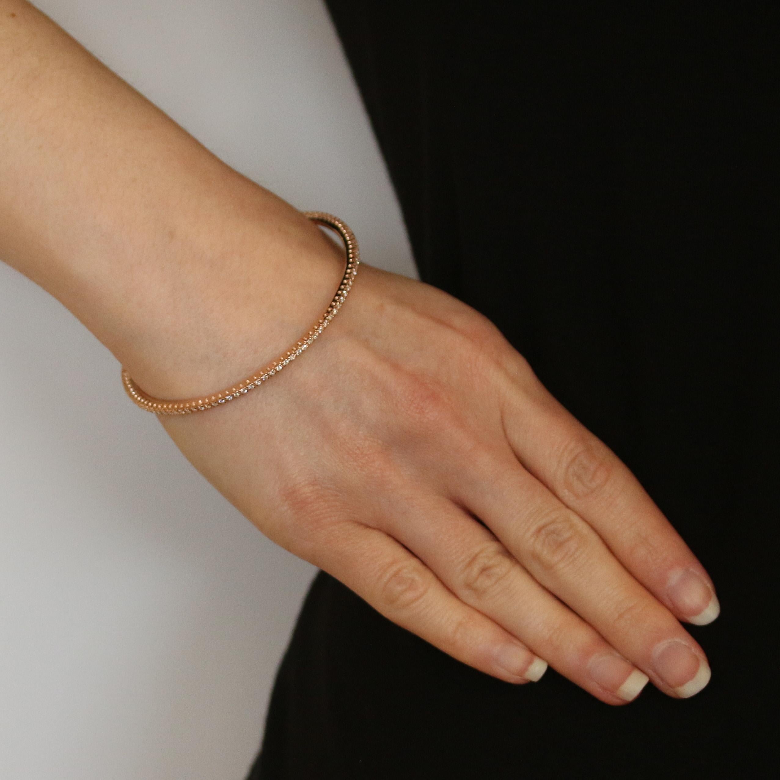 Metal Content: 14k Rose Gold  

Stone Information: 
Natural Diamonds
Total Carats: 1.05ctw
Cut: Round Brilliant 
Color: G - H   
Clarity: SI1 - SI2 

Bracelet Style: Stackable Bangle 
Closure Type: N/A (slides over wrist)

Measurements: 
Inner