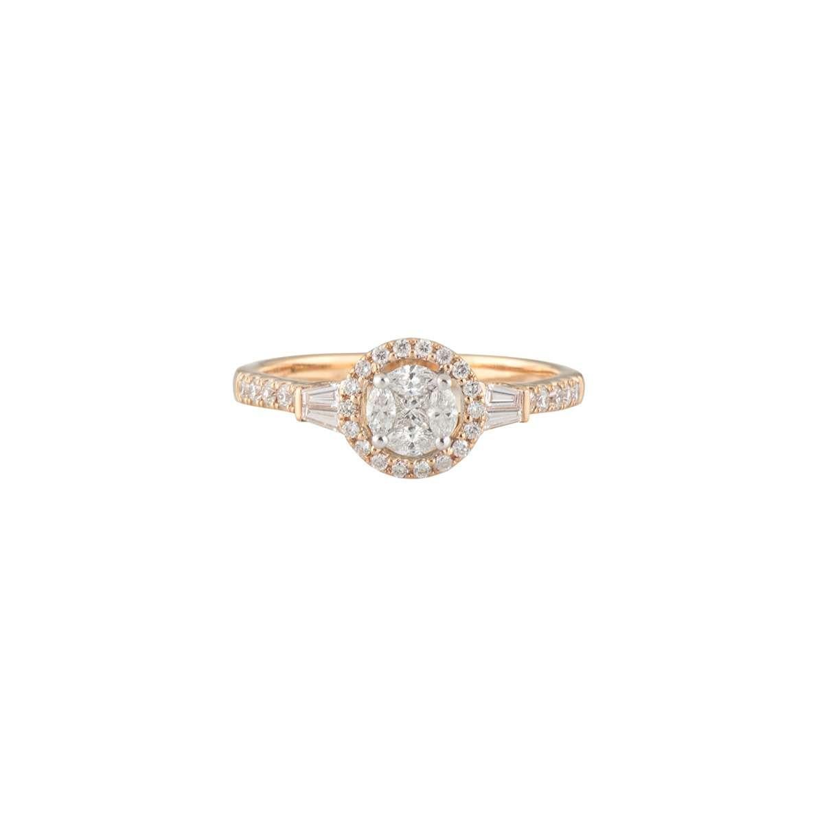 A sparkly 18k rose gold diamond ring. The ring comprises of 4 marquise cut diamonds set in a circle with a princess cut diamond set in the middle, creating an illusion of a round diamond. Complementing the centre are a halo of round brilliant cut