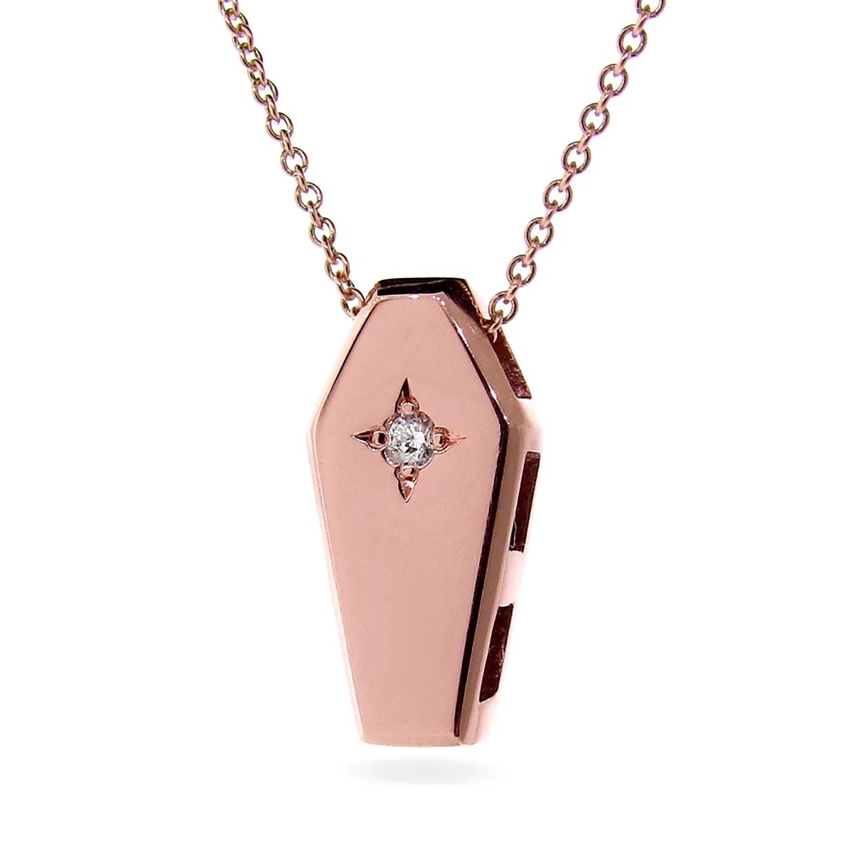 Our unique Rose Gold Diamond Coffin Pendant, is crafted from solid 9k Rose Gold and a natural White star set Diamond, and hangs from a dainty 45cm 9k rose gold cable chain, This exquisite piece captures a timeless sentiment of mortality, a solemn
