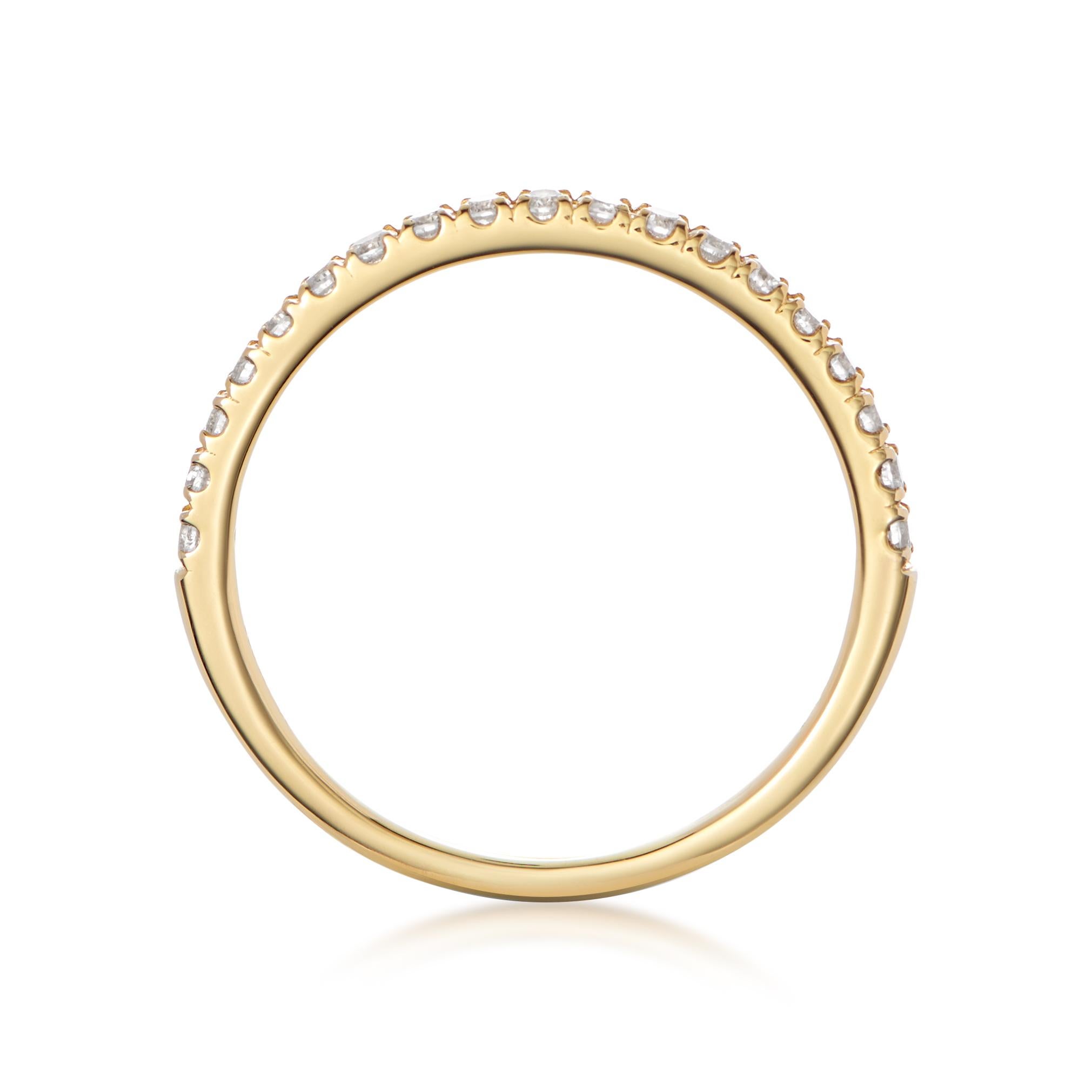 Fine gold band 1/2 set with white diamonds. Ideal for stacking or for a more delicate look, wear it on its own. Court shaped on inside for maximum comfort. Comes in rose gold, yellow gold and white gold. All 3 together look fabulous. 

- 18 karat