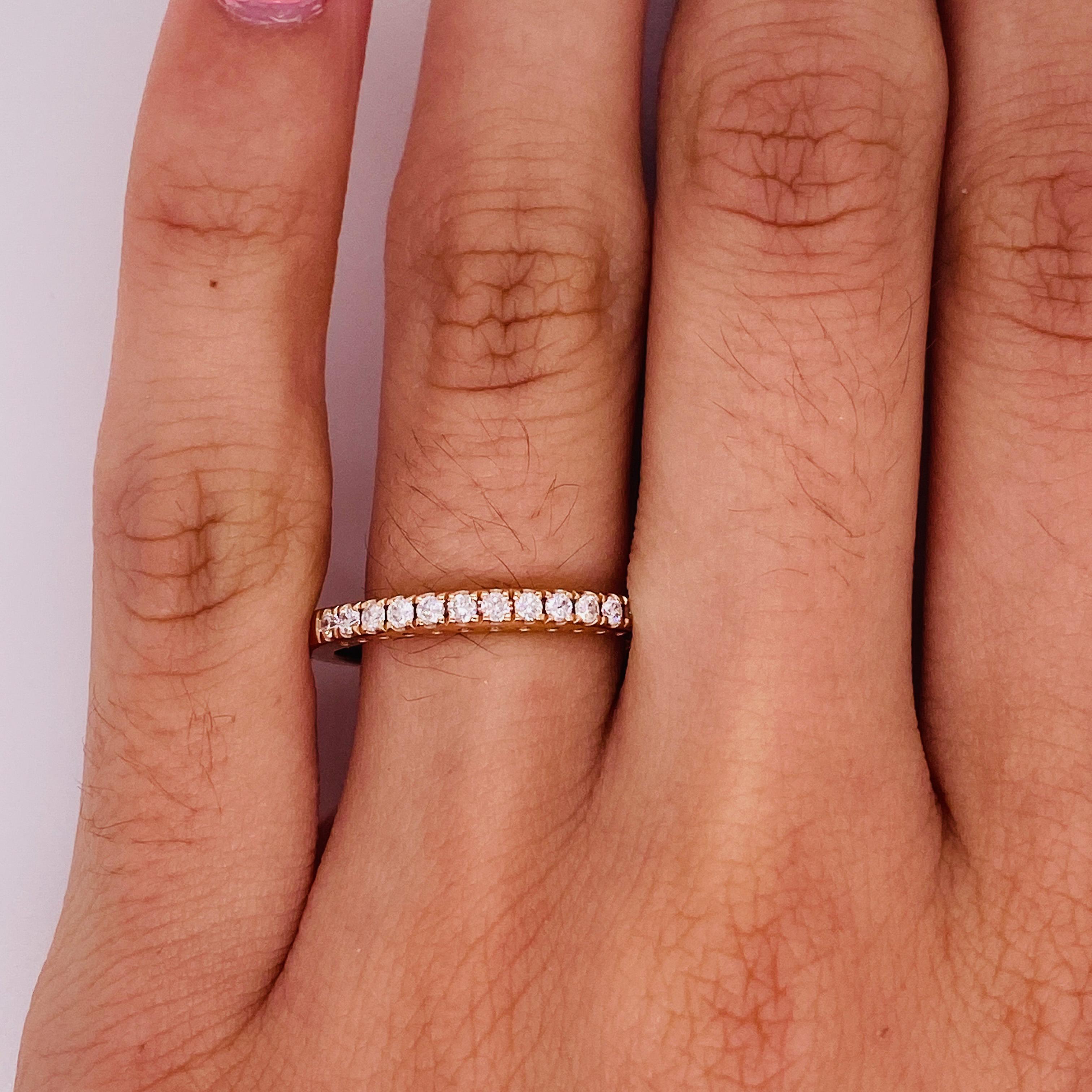 A rose gold classic and timeless piece! This beautiful 14 karat rose gold, half-diamond band is an excellent option for a wedding band, stackable ring, or stand-alone ring. This ring is stunning and elegant. The ring we have here in our store is