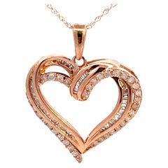 Collana con cuore in oro rosa e diamanti