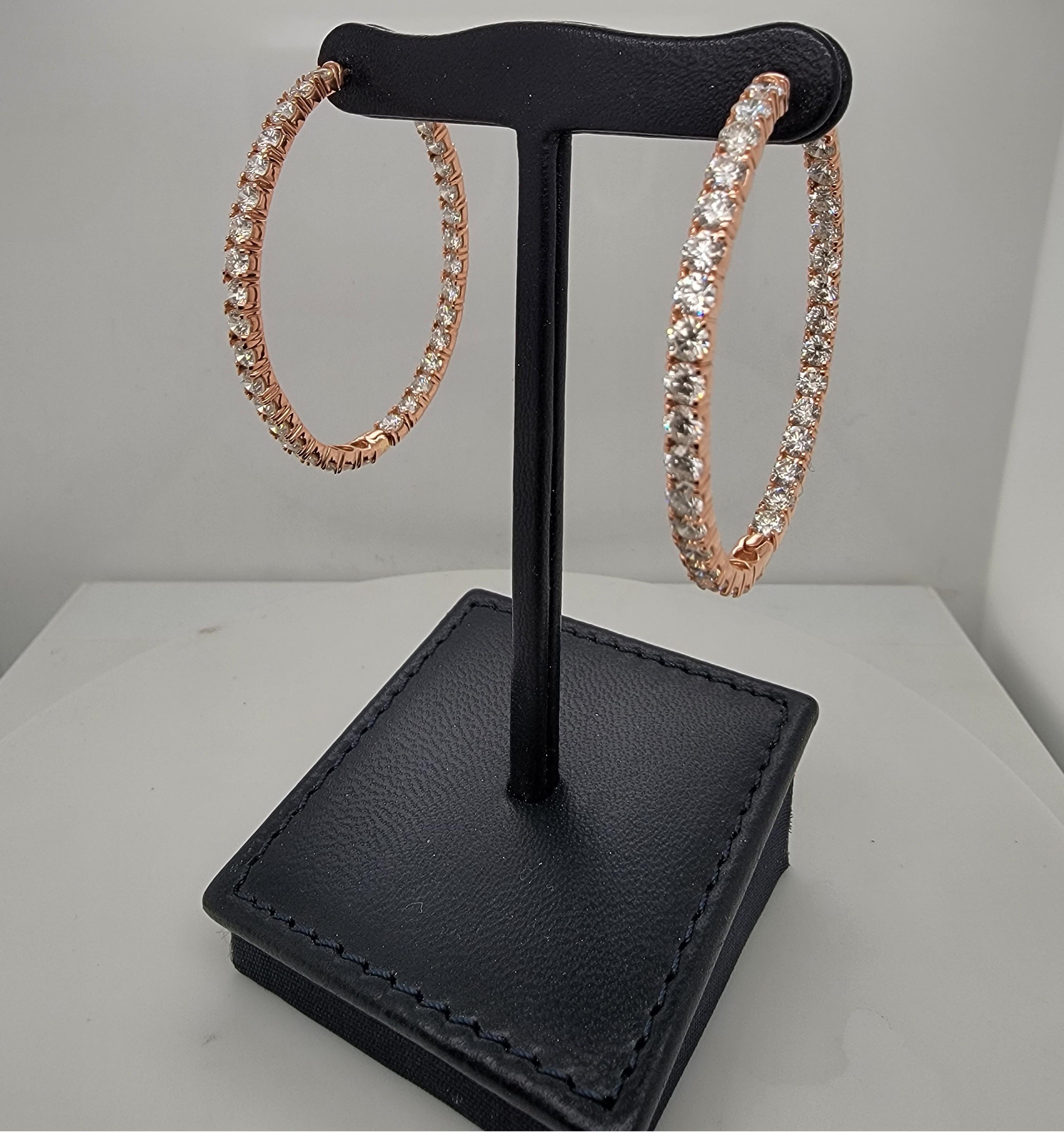 Show stopping rose gold and diamond oval hoops. 

These gorgeous earrings are set with 7.80 carats of ideal cut (for maximum brilliance) and colorless (d-e-f) diamonds in rose gold. These super unique oval shape earrings are super bright and