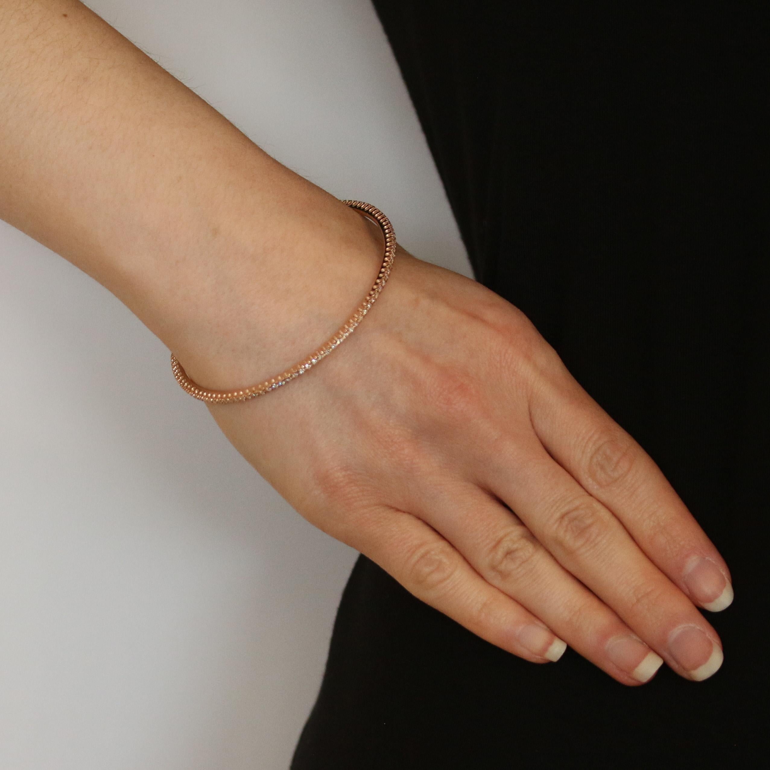 Metal Content: 14k Rose Gold  

Stone Information: 
Natural Diamonds
Total Carats: 1.05ctw
Cut: Round Brilliant 
Color: G - H   
Clarity: SI1 - SI2 

Bracelet Style: Stackable Bangle 
Closure Type: N/A (slides over wrist)

Measurements: 
Inner