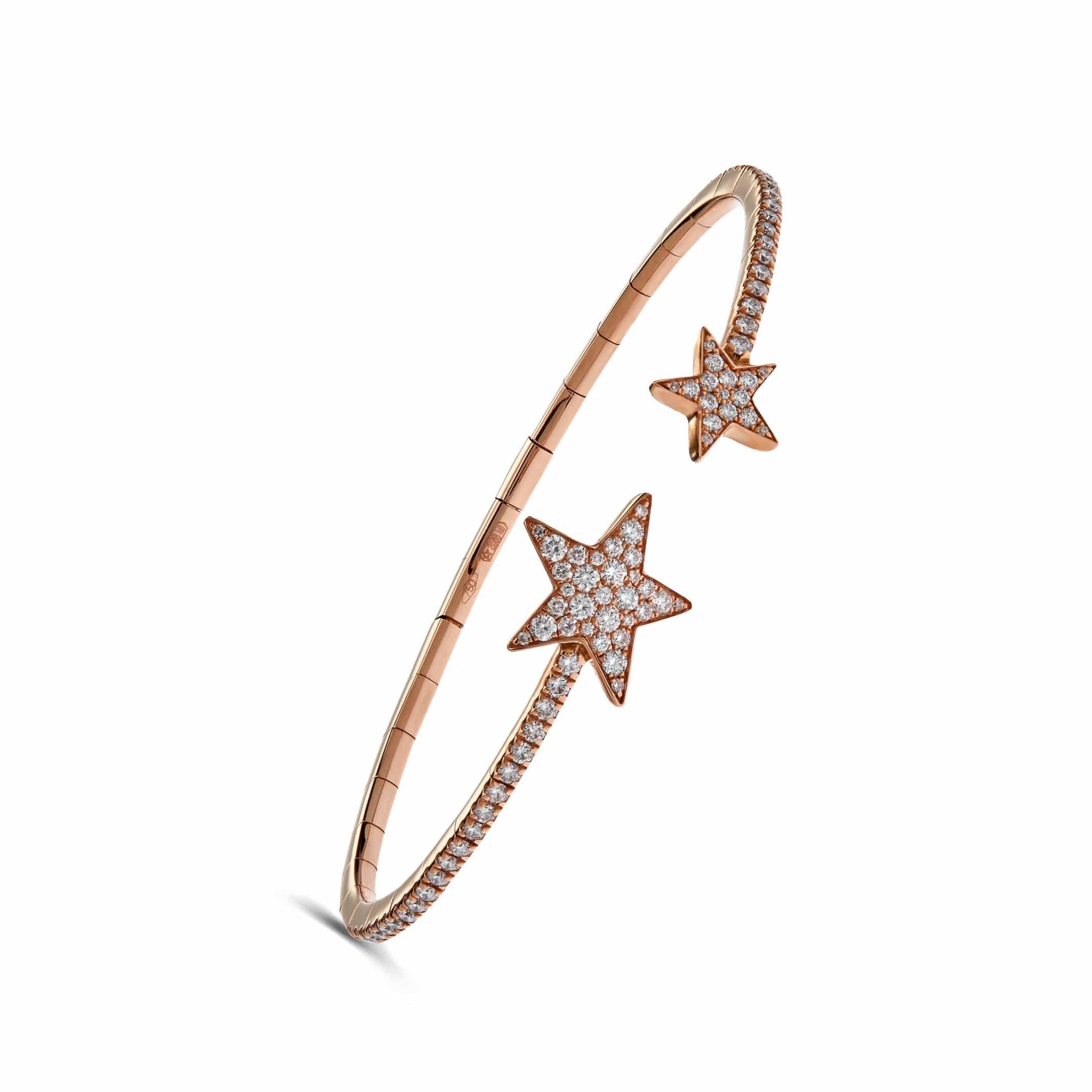 Pave set with a total of 1.04 carats of white round brilliant diamonds meticulously crafted on a thin 18k Rose Gold bangle. The flexible bracelet is completed with two diamond set stars.

Details
18K Rose Gold, 7.60 Grams
1.04 Carats of Round