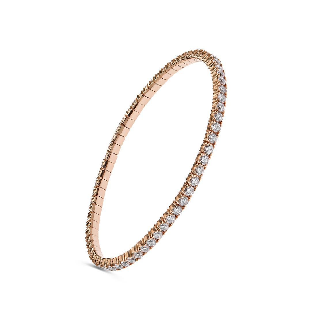 This stunning stretch bangle features four-prong set round brilliant diamonds totaling 4.64 carats. A versatile and elegant diamond tennis bracelet, this piece fits many wrist sizes and is meticulously manufactured in Italy, making it a must-have