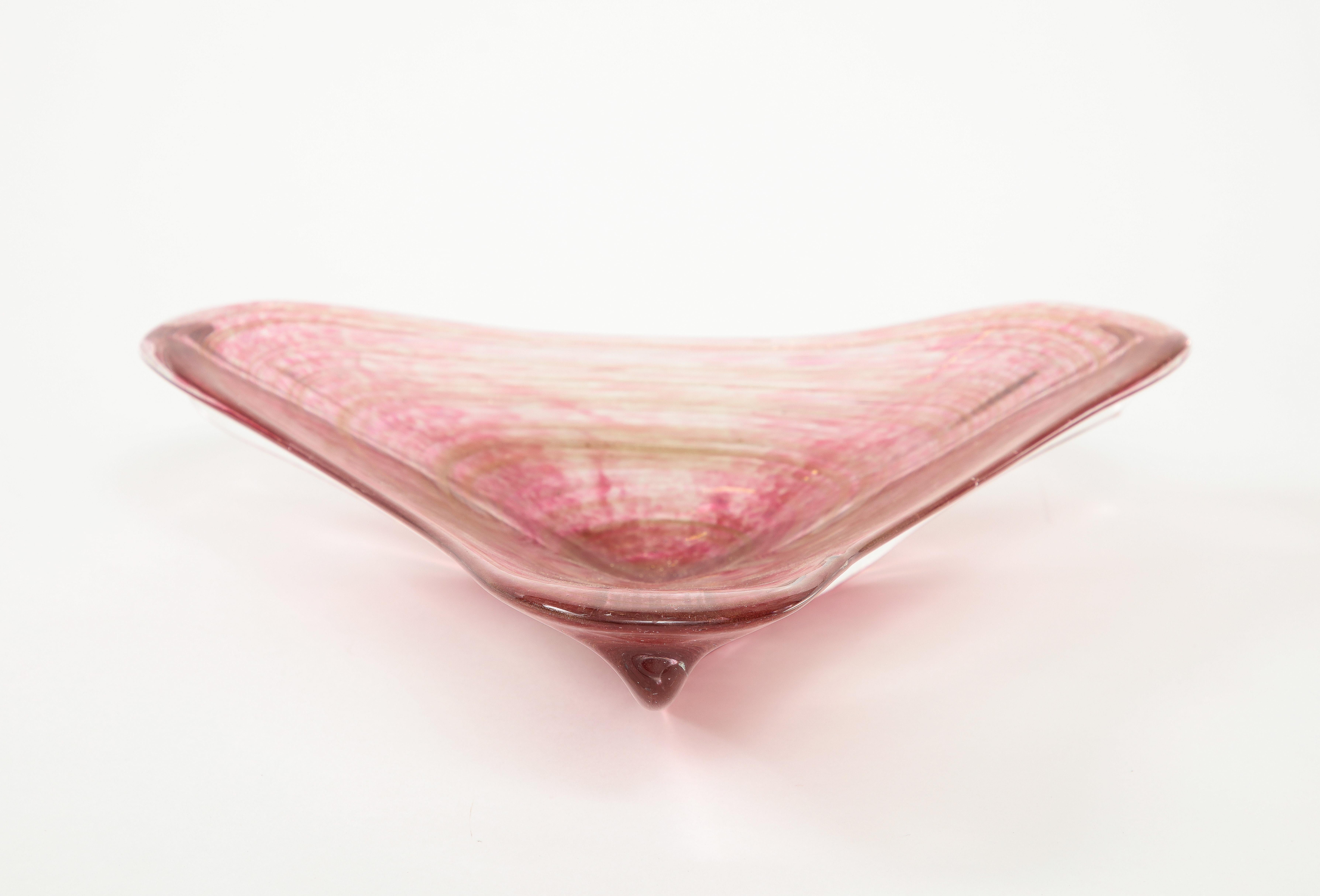 Modernist 1950s Rose colored Murano glass boomer rang shaped glass catch all, featuring gold dust inclusion throughout.