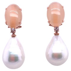 Boucles d'oreilles en or rose, perles de couleur pêche et diamants 0,14 carat