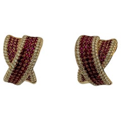 Orecchini in oro rosa con diamanti naturali e rubini