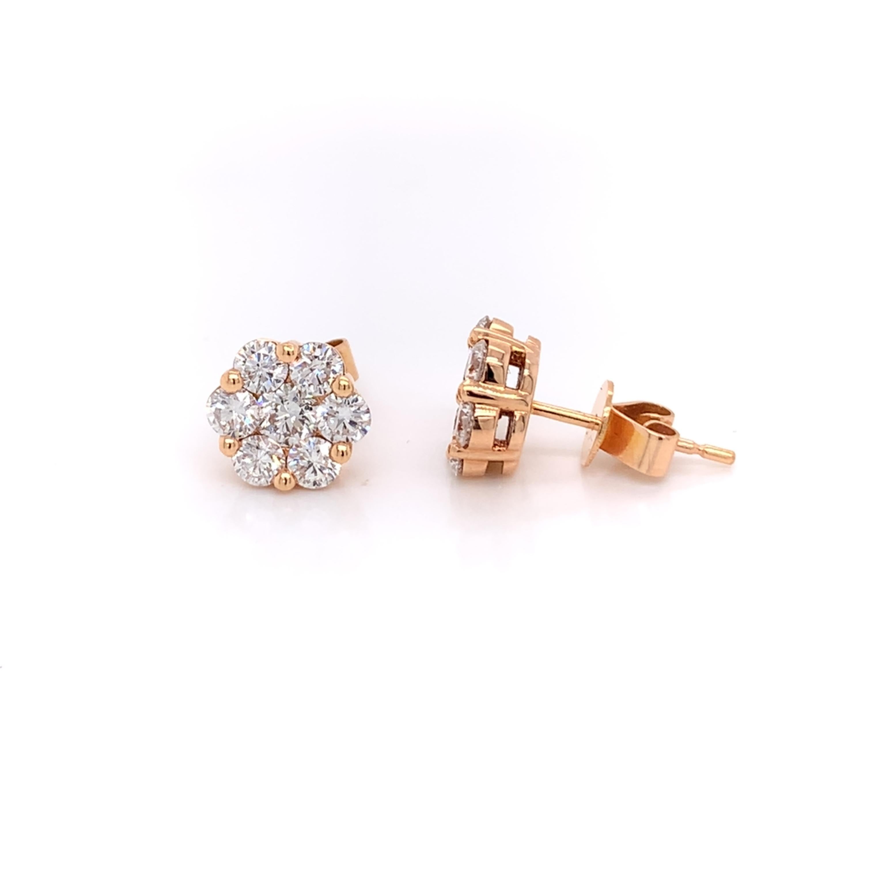Rose shaped diamond stud earrings made with real/natural brilliant cut diamonds. Total Diamond Weight: 1.59 carats. Diamond Quantity: 14 round diamonds. Diamond Color: G-H. Clarity: VS. Mounted on 18 karat rose gold push-back setting