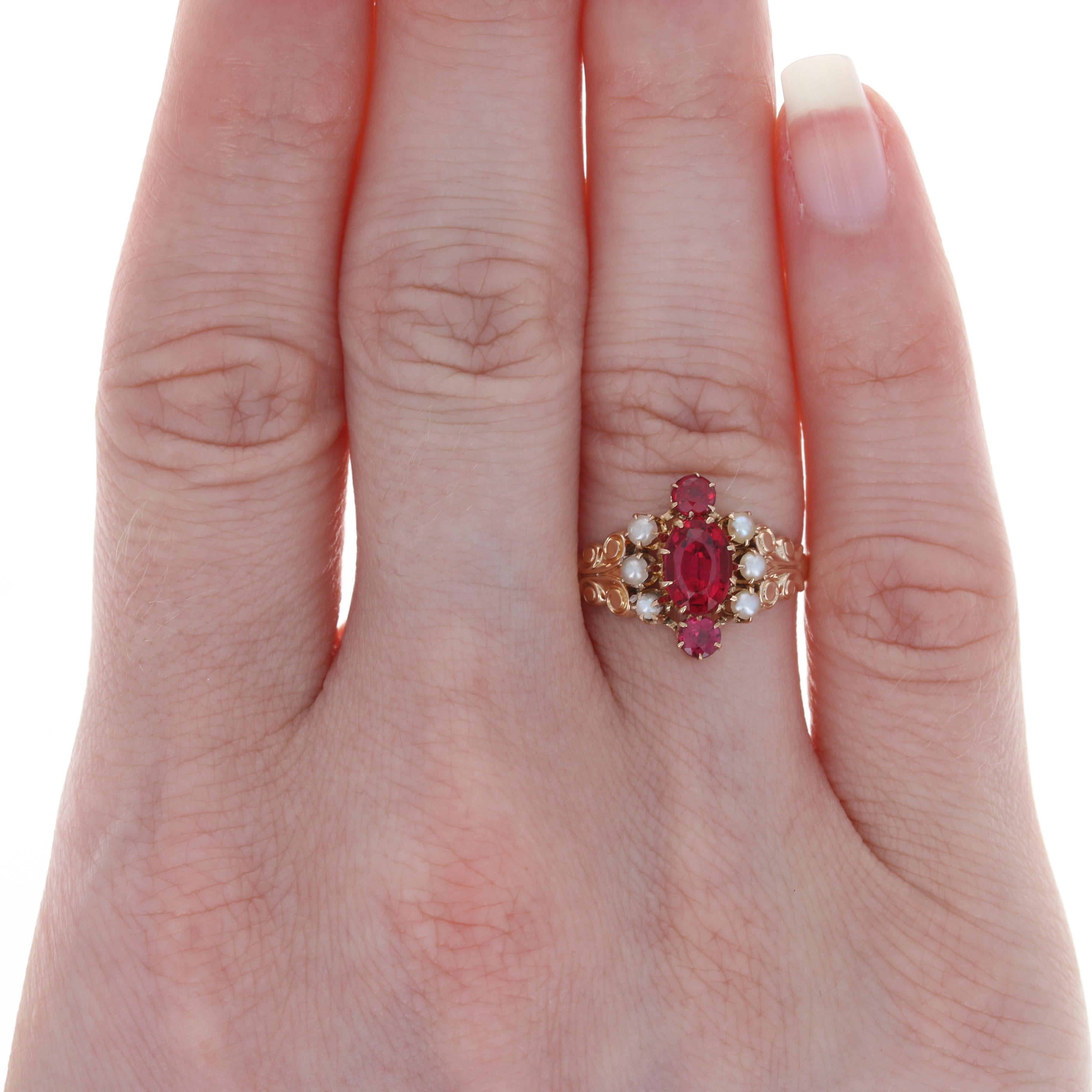 Size: 6
 Sizing Fee: Up 2 sizes or down 1 size for $25
 
 Era: Victorian 1880s - 1890s
 
 Metal Content: 10k Rose Gold 
 
 Stone Information: 
 Genuine Garnet / Glass Doublets
 Cuts: Oval & Round
 Color: Red
 Solitaire's Size: 7.1mm X 5mm
 
 Genuine