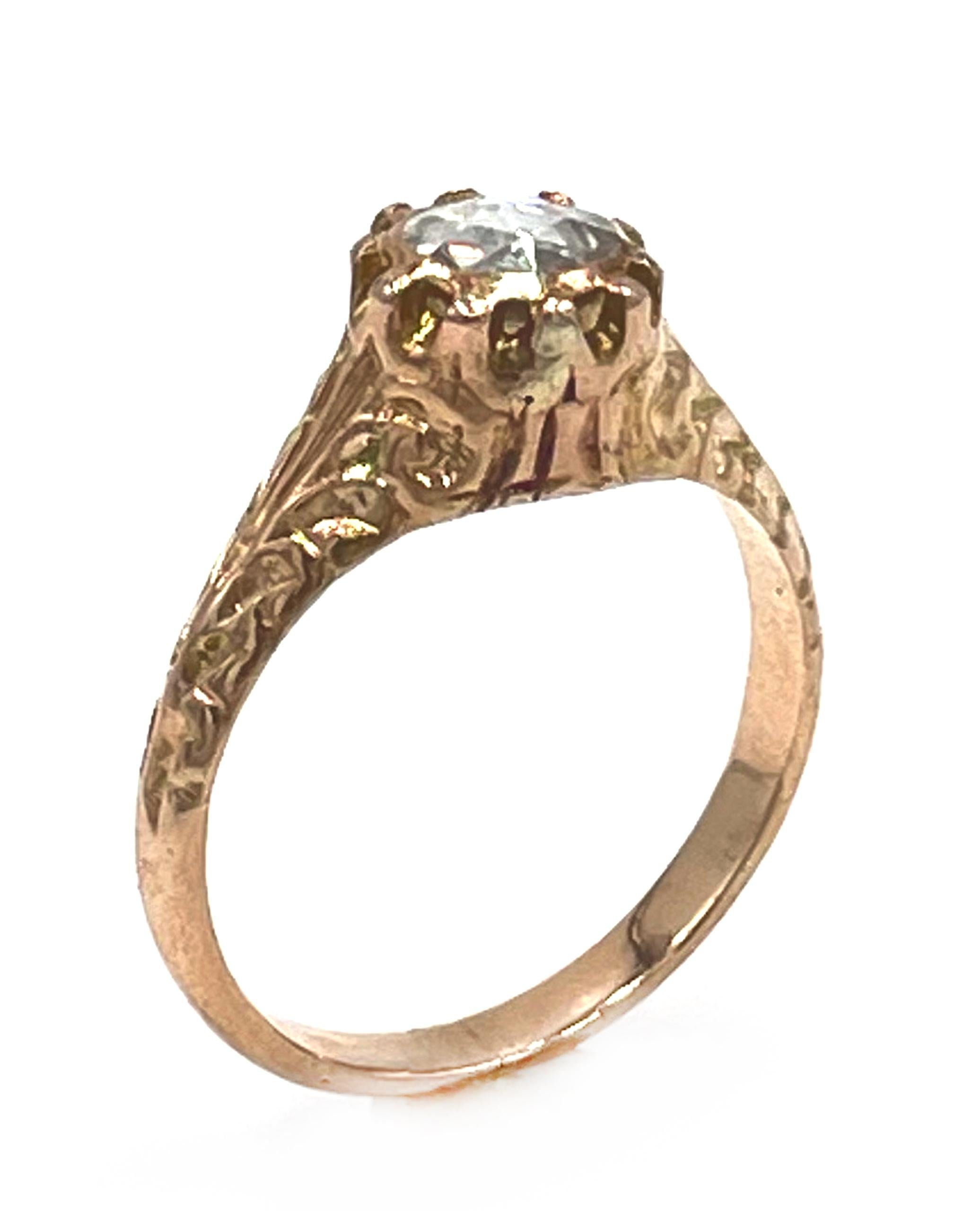 Rose gold antique Georgian style solitaire ring with hand engraving.  The ring features in the center one rose cut salt and pepper diamond weighing approximately 0.55 carats.

* Finger size 6.75