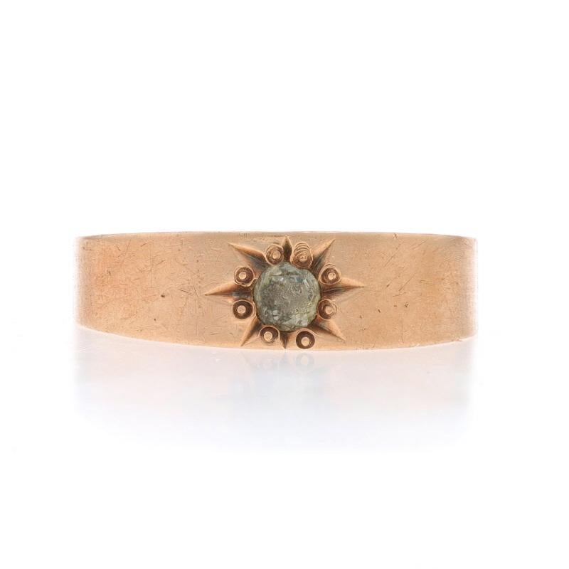 Size: 6 1/2

Era: Edwardian

Metal Content: 14k Rose Gold

Stone Information

Glass
Cut: Rose
Stone Note: abraded

Style: Solitaire
Theme: Starburst

Measurements

Face Height (north to south): 1/4