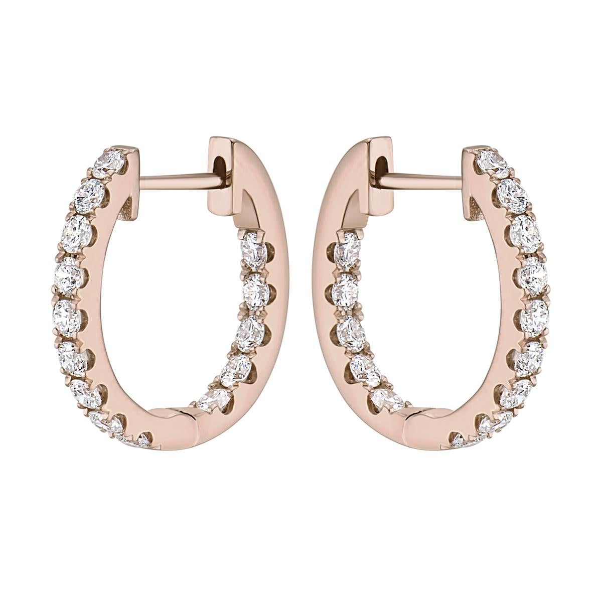 With these exquisite rose gold huggies hoop diamond earrings, style and glamour are in the spotlight. These rose gold hoop earrings are set in 14-karat gold and made from 4.2 grams of gold. The color of the diamonds is GH. The clarity is SI1. These