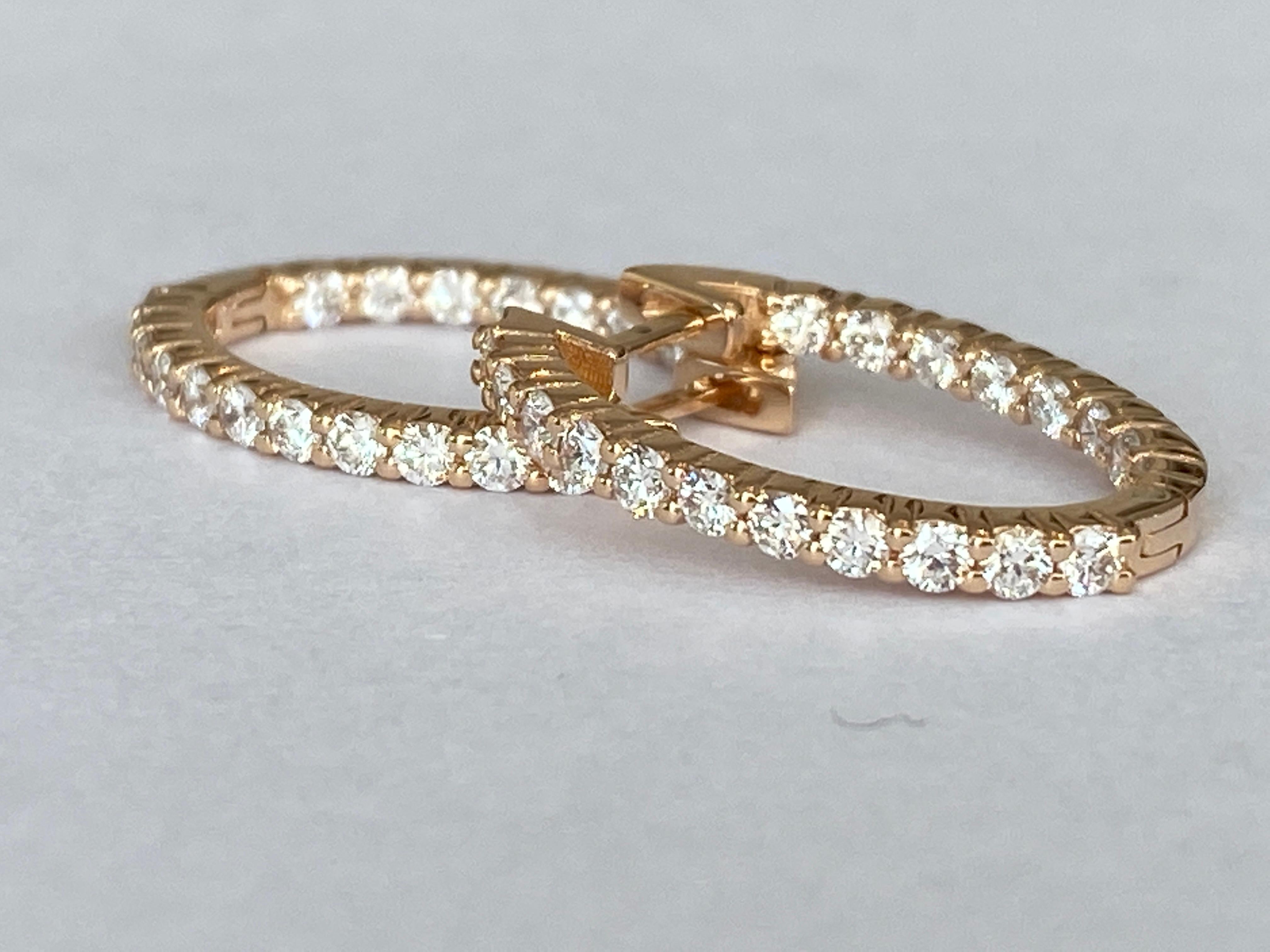Rose gold huggie hoop diamond earrings are a stunning choice! These earrings are designed to hug the earlobe closely, offering a sleek and elegant look. The rose gold adds a warm, romantic touch, while the diamonds provide a sparkling accent that