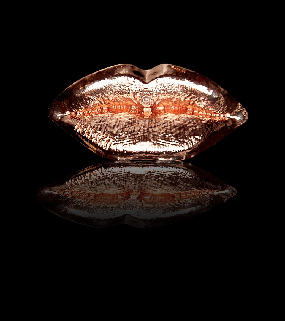 The classic Lips Ring, now with a rosier touch.  Whisper. Shout. Kiss. The lips are one of the sexiest features of the face. Available in 24k yellow gold, white gold, and rose gold finish on 3d printed brass lips and baroque ring. Make everyone kiss