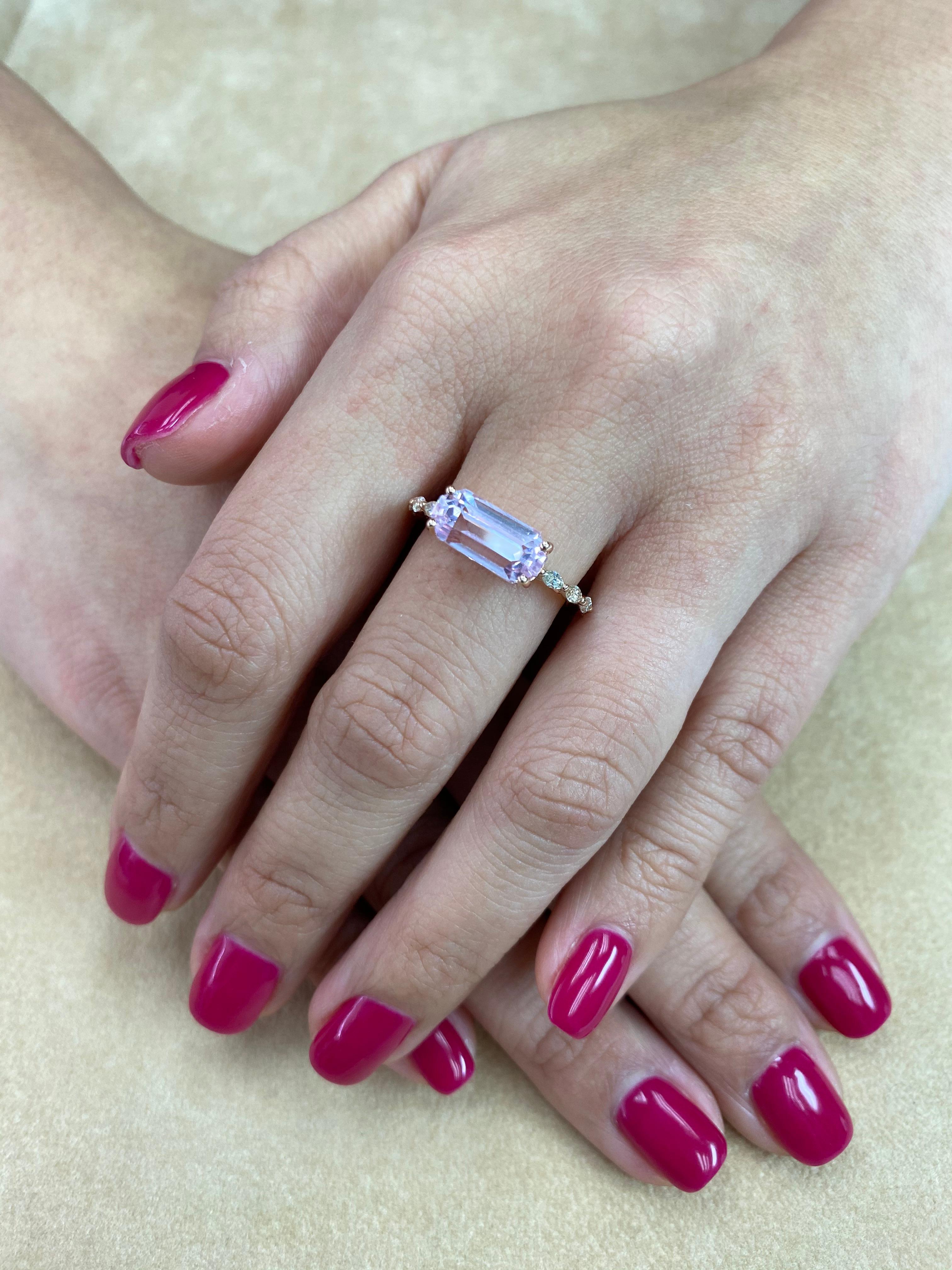 Here is a beautiful Kunzite and diamond cocktail ring. The ring is set in 18k rose gold and diamonds. There are 8 Marquis diamonds on the shanks of the ring. The Kunzite ring is full of life. The modified step cut is very unique. The baby pink color