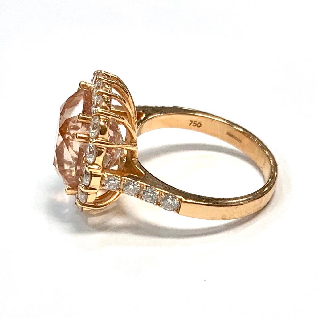 Edwardian Style Morganite and Diamond CLuster Ring. Set with one large central cushion shape Morganite surrounded by sixteen Round Brilliant cut Diamonds. Set with eight Round Brilliant cut Diamonds on the shoulders. (four each side) With basket