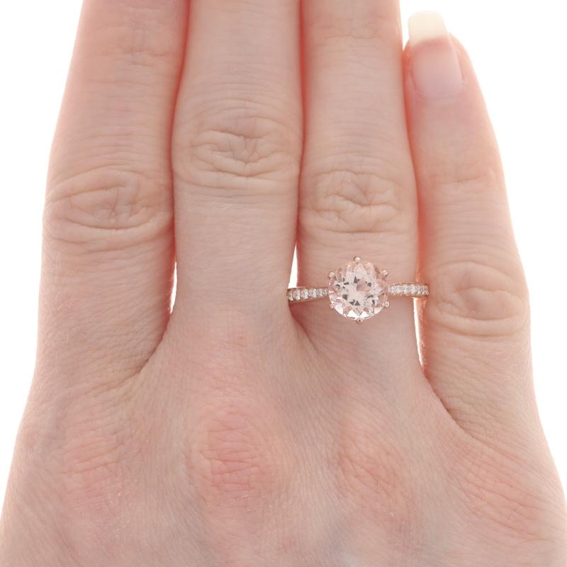 Size: 6 1/2
Sizing Fee: Up 2 sizes for $45 or Down 1 size for $45

Metal Content: 14k Rose Gold

Stone Information
Natural Morganite
Carat(s): 1.85ct
Cut: Round
Color: Light Pink

Natural Diamonds
Carat(s): .23ctw
Cut: Round Brilliant
Color: