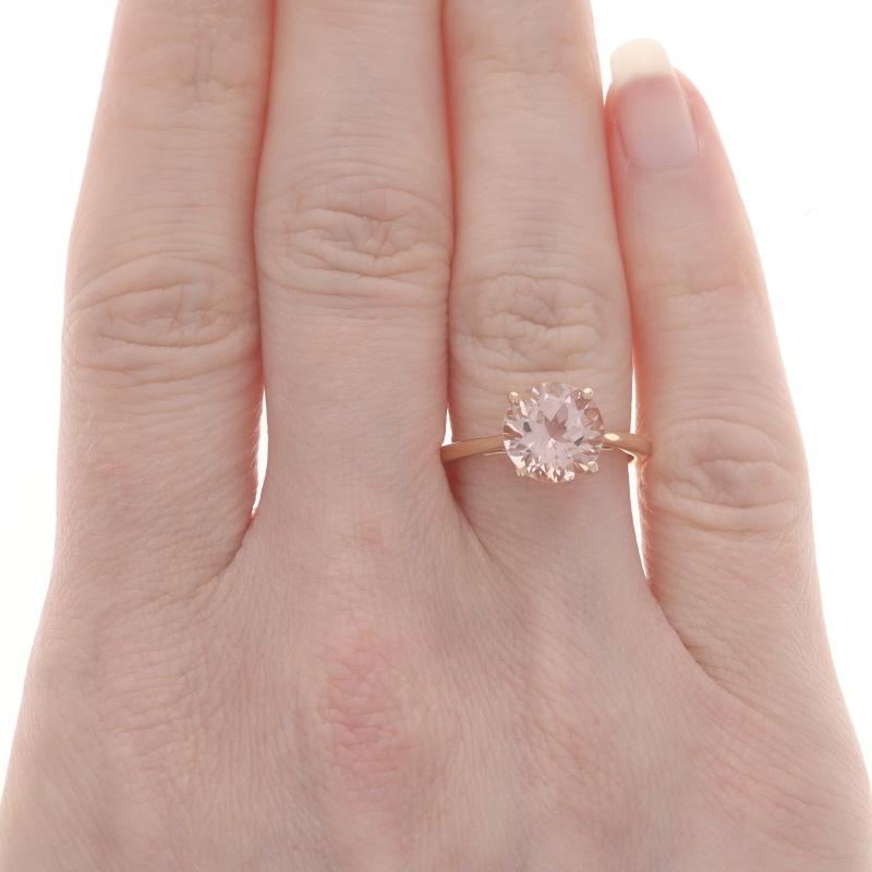 Size: 6 1/4
Sizing Fee: Up 1 size for $35 or Down 1 1/2 sizes for $35

Metal Content: 10k Rose Gold

Stone Information

Natural Morganite
Carat(s): 2.08ct
Cut: Round
Color: Light Pink

Total Carats: 2.08ct

Style: Solitaire

Measurements

Face