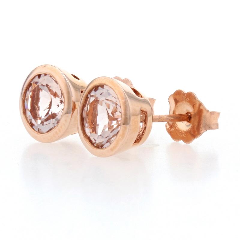 Metal Content: 14k Rose Gold 

Stone Information: 
Genuine Morganites
Total Carats: 1.20ctw
Cut: Round 
Color: Pink

Style: Stud 
Fastening Type: Butterfly Closures 

Measurements: 
Diameter: 5/16