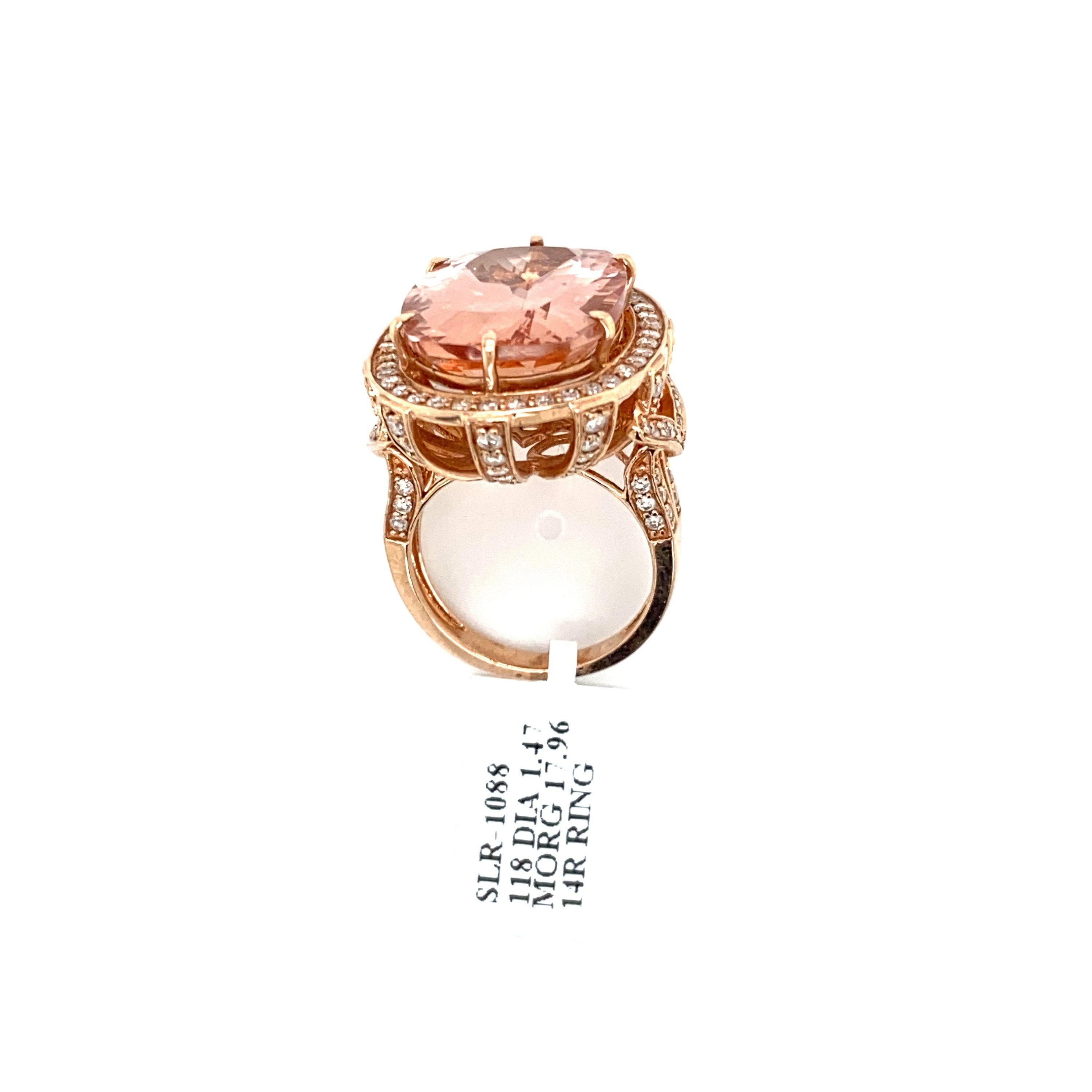 This stunning natural morganite and diamond encrusted ring is set in solid 14K rose gold. The natural 17.96 Ct cushion cut morganite has an excellent peachy pink color and is surrounded by a halo of round cut white diamonds. The ring is stamped 14K
