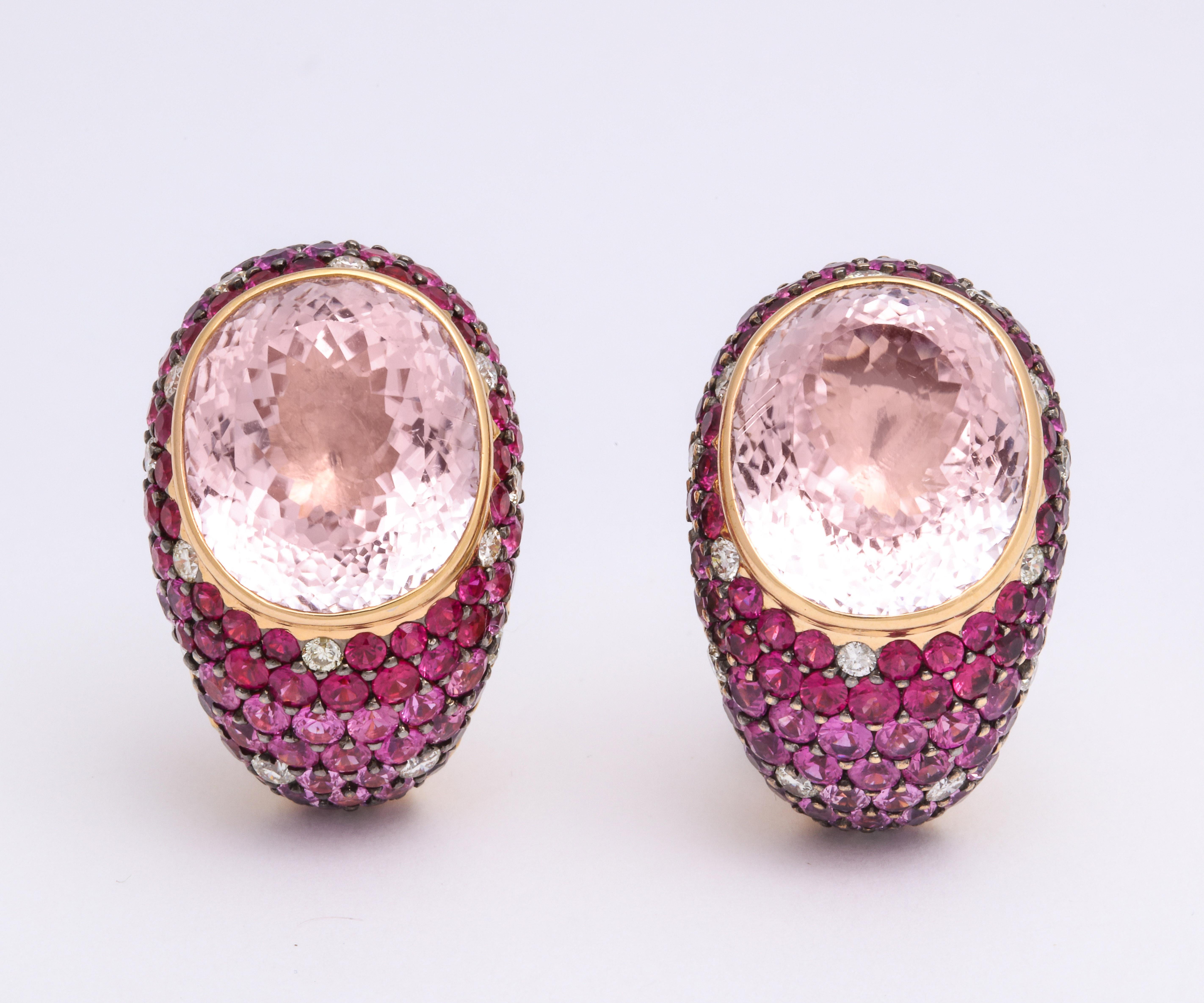 Smart and festive 18K rose gold bombe' (domed) earclips mounted with bezel-set oval shaped faceted skin-tone kunzite: 25.80 carats, decorated with pave'-set, diamond-cut, multi color striae pink sapphires: 8.13 carats, and staggered round