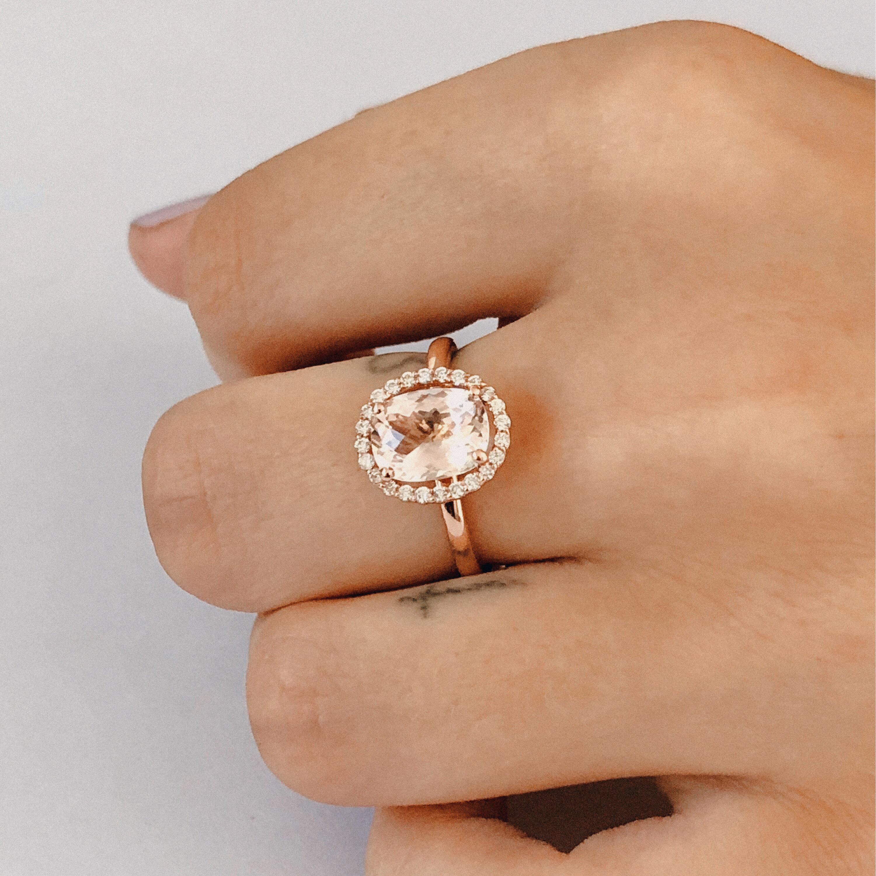 14 Karat rose gold cocktail ring 
Oval shape morganite weighing 2 carat 
Halo diamond ring 
Surrounded by pave set diamonds weighing 0.34 carat
Ring size 7 In Stock
New Ring
Ring can be resized 

