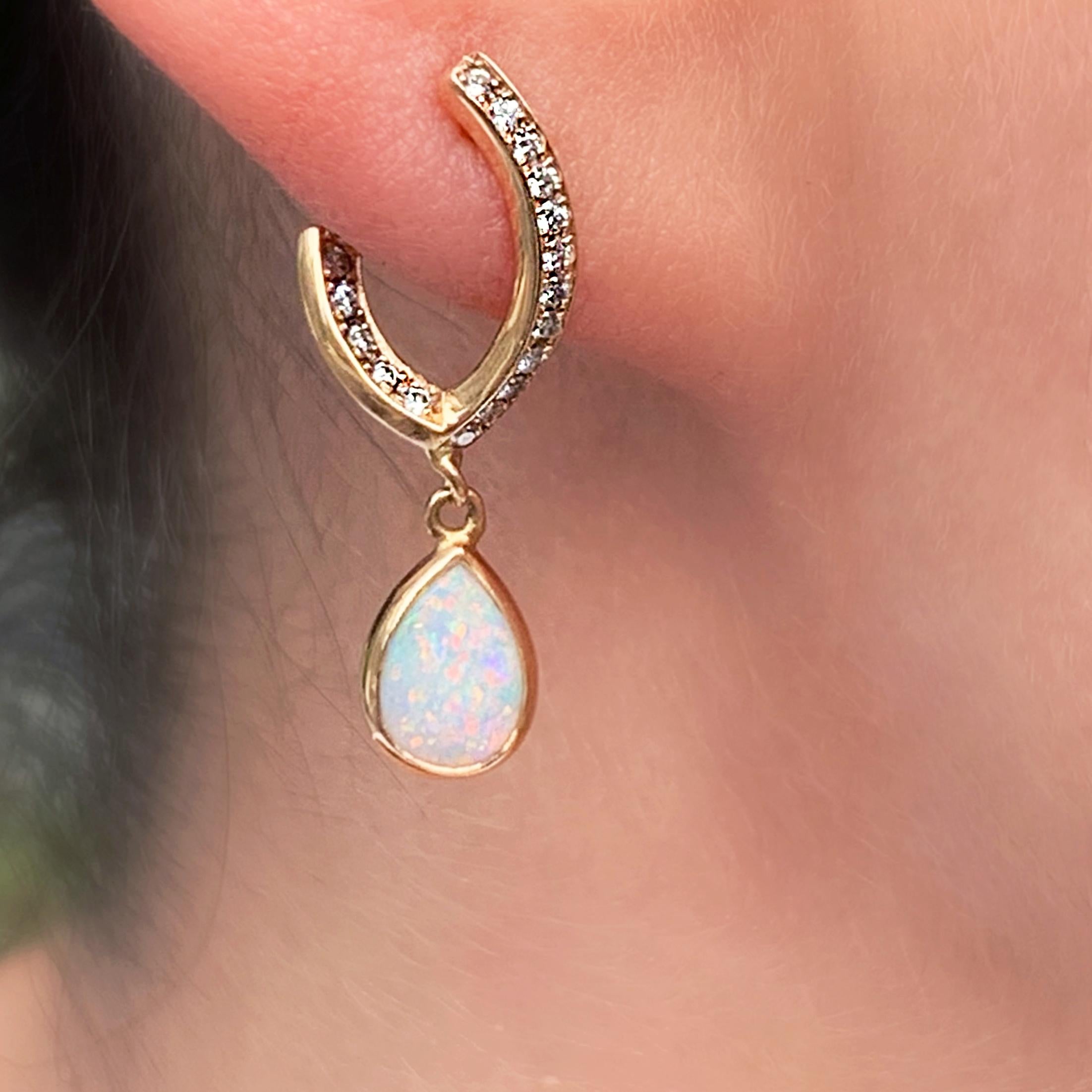 Drop earrings in 18K rose gold 3 g.  Pave set with white brilliant-cut DEGVVS diamonds 0,23 ct. and 2 white Australian opal pear shape drops in bezel setting. Collection 'Opale Fatale' 
This exquisite product comes from Joke Quick, a jewellery