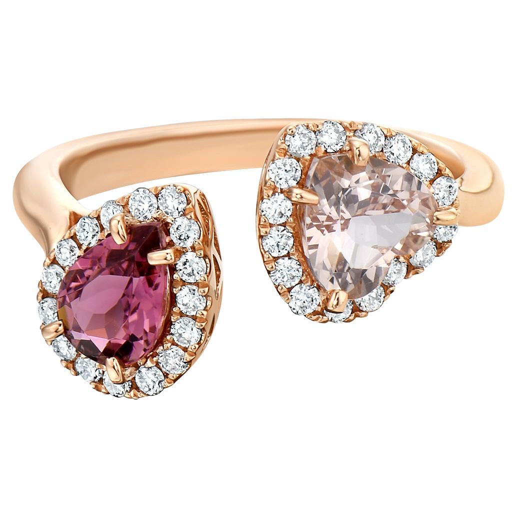 With this exquisite semi-precious rose gold pear pink tourmaline and heart morganite diamond ring, style and glamour are in the spotlight. This 14-karat ring is made from 3.4 grams of gold, 1 pear shape pink tourmaline 
totaling 0.61 karats and 1