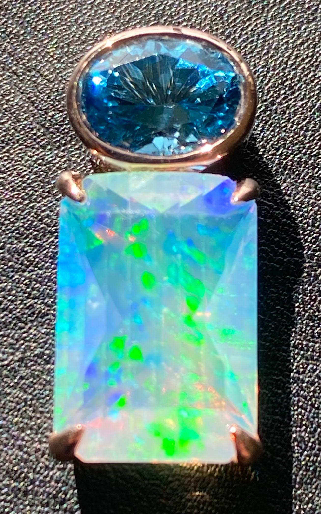 Topaz & Opal Pendant set in 14kt Rose Gold. This lovely pendant hangs from an 18