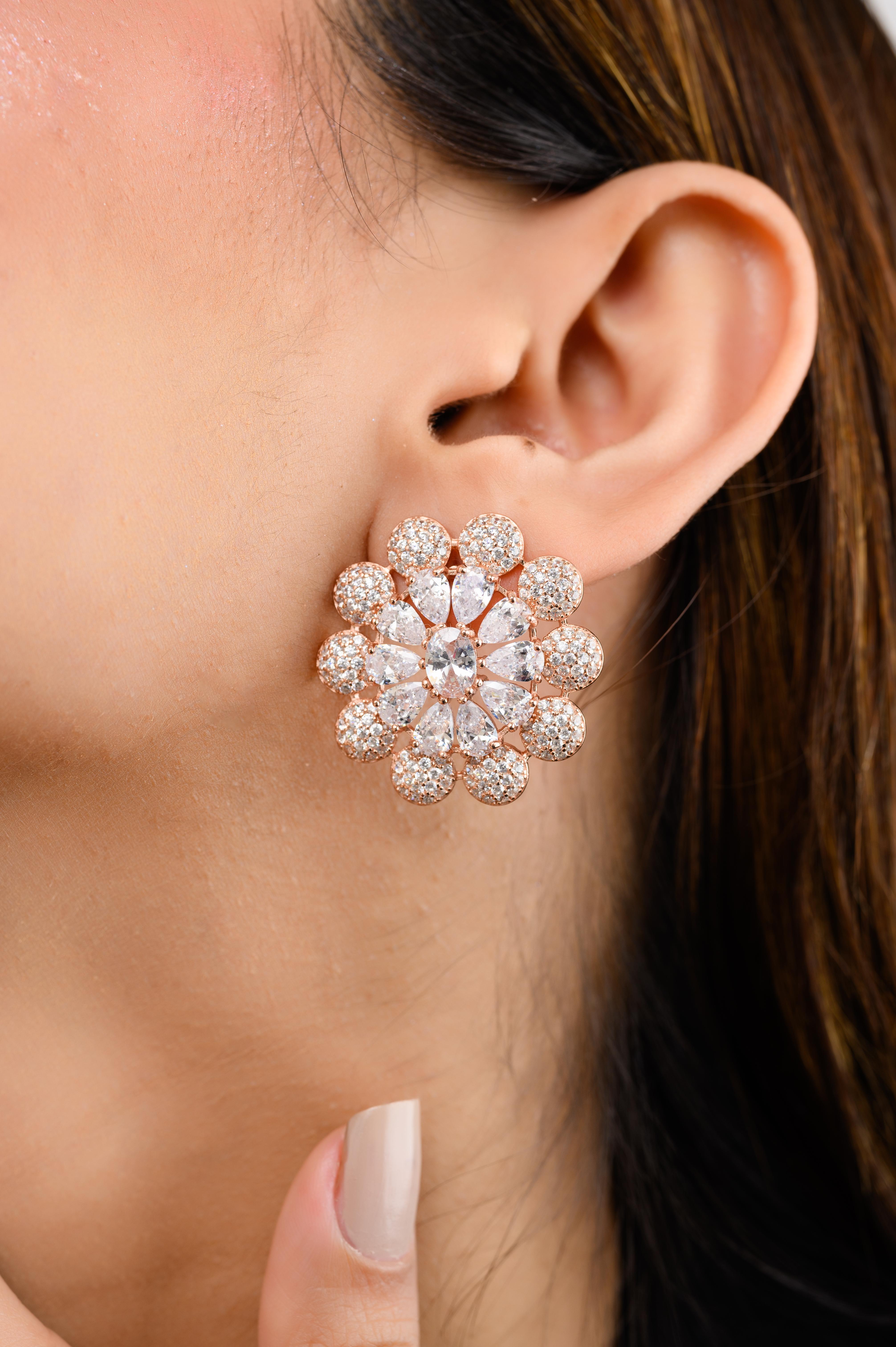Brilliant Cut Cubic Zirconia Floral Stud Earrings  in sterling silver. You shall need floral stud earrings to make a statement with your look. Each piece features dazzling cubic zirconia stones, renowned for their brilliance and clarity, set in