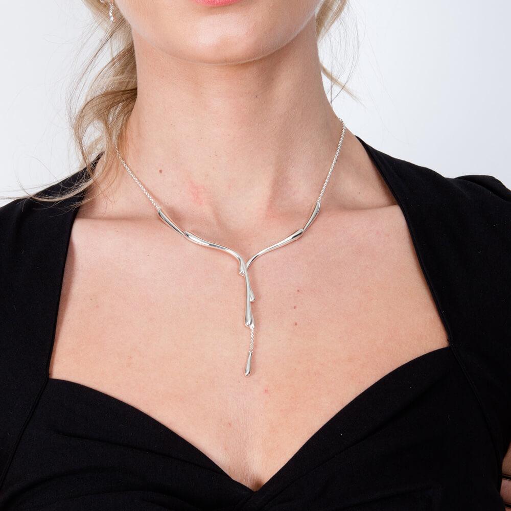Flowing necklace from the Drop Collection. The amazing Y-shaped necklace emulates pouring silver down the neckline, ultimately stunning.

Hand Made from the highest quality 925 Sterling Silver and Hallmarked in the UK. Finished off with a simple