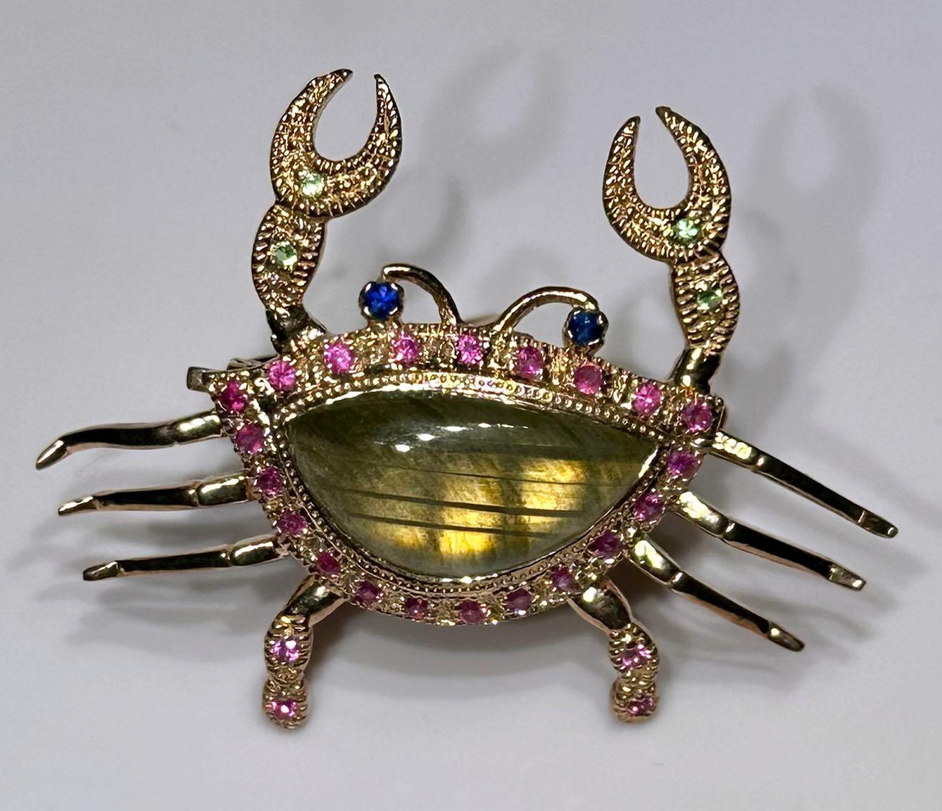 This one of a kind Rose Gold Plated Silver Crab Brooch/Pendant is set with Sapphire, Labradorite & Tsavorite garnets. The body of the crab is one large cabochon Labradorite. The Brooch has a fold down Bail so that this piece can be used as either a