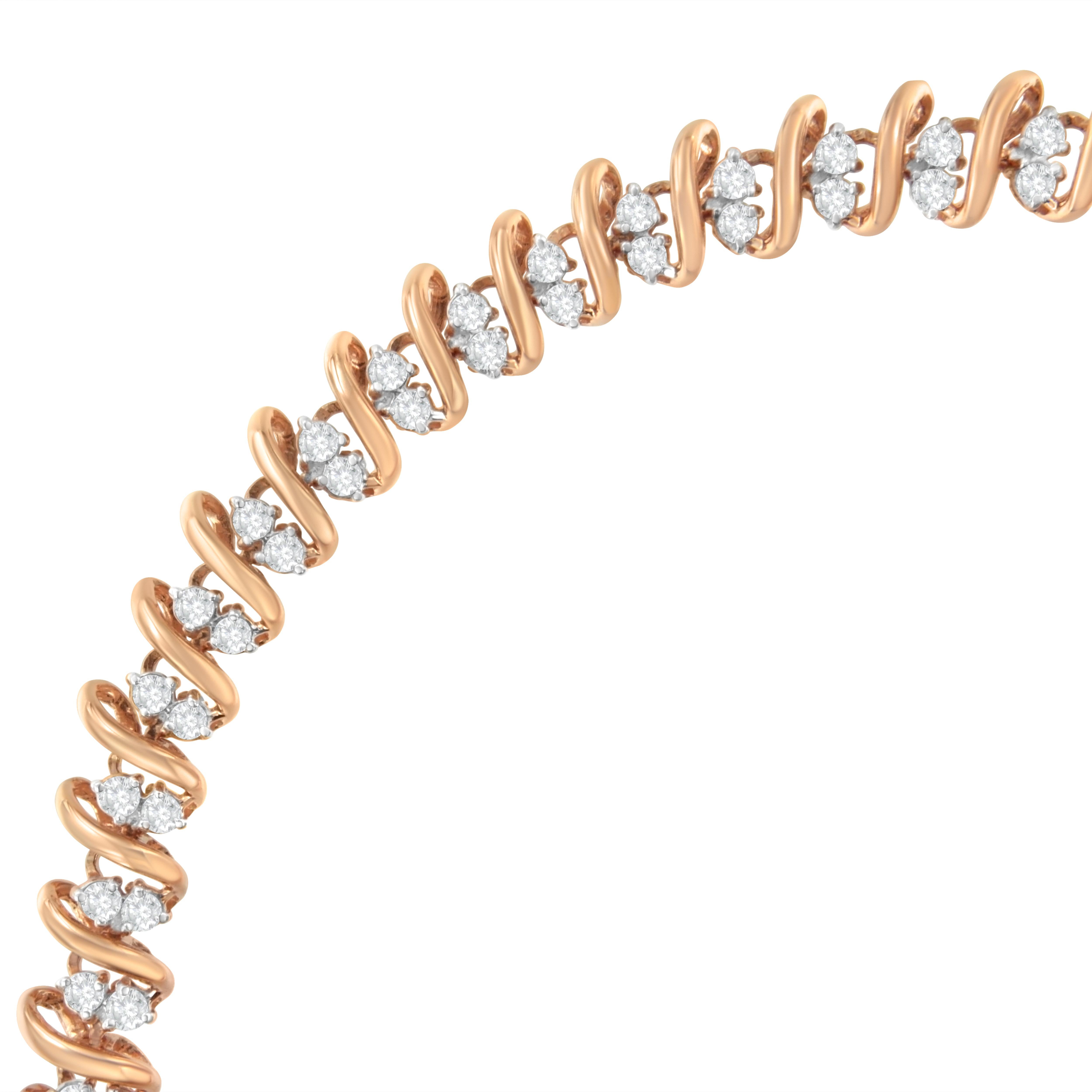 This captivating bracelet design is a real masterpiece. Created in 14k rose gold plated sterling silver, this design showcases 2ct TDW of diamonds. A spiral band of rose gold wraps around a double row of dazzling round cut diamonds. The bracelet