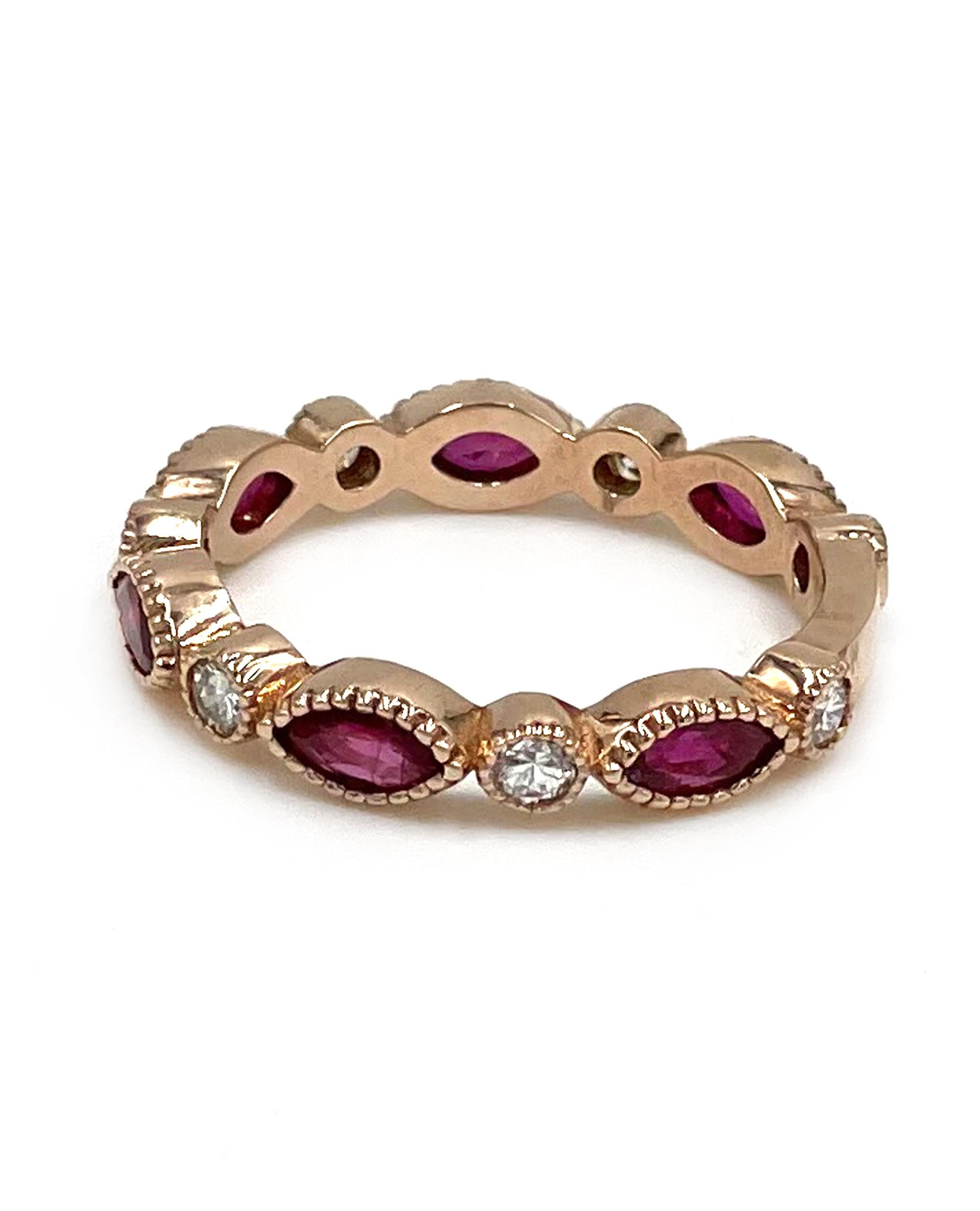 14k rose gold eternity band with 7 diamonds totaling 0.36 carats and 6 marquise-shaped rubies totaling 1.16 carats.

- Finger size 7.25
- G/H color, SI1/SI2 clarity
- Miligrain edged detail
- Stackable with other rings